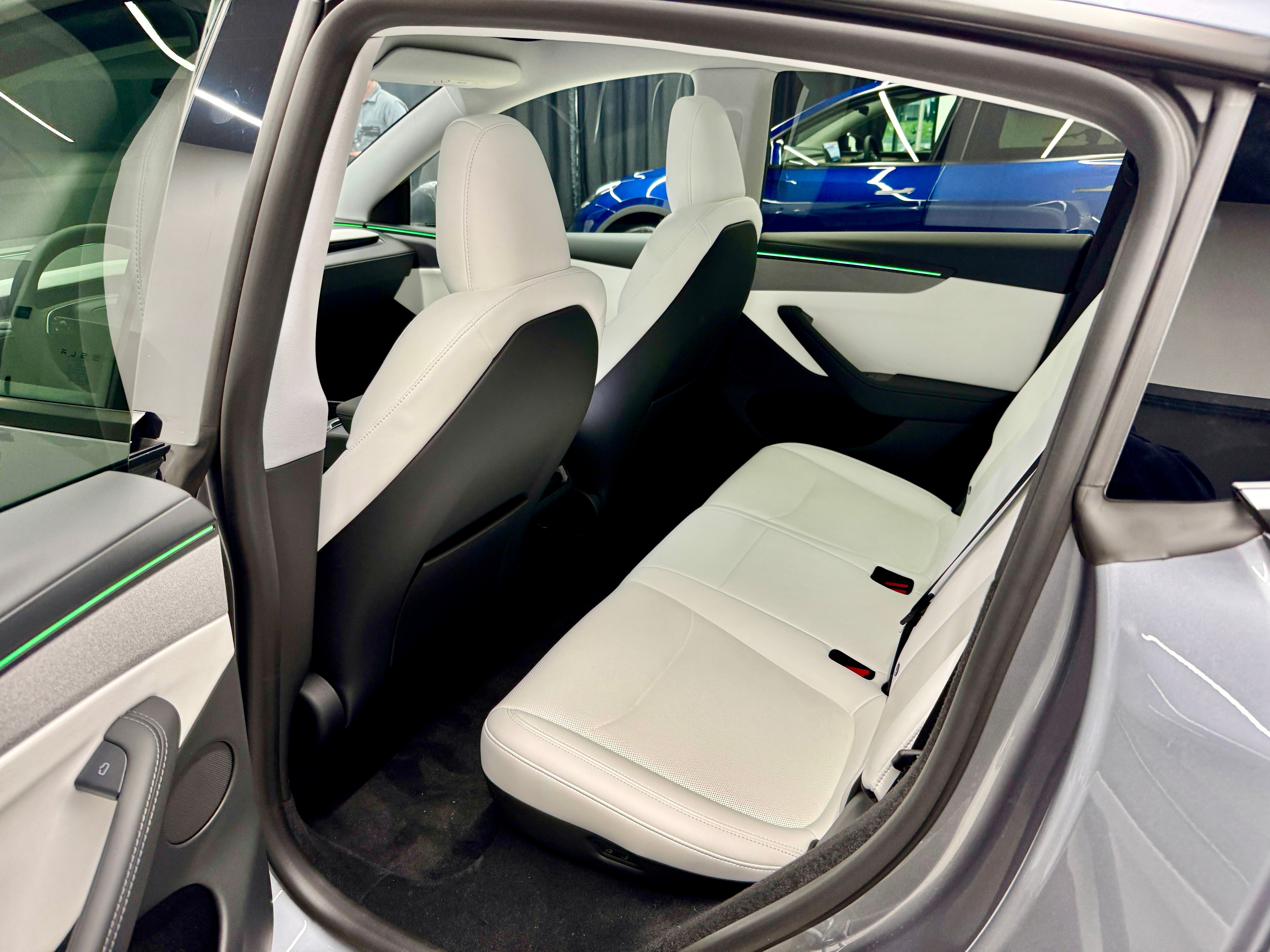 The back seats in the new Tesla Model Y are now powered and can be reclined slightly, or folded completely flat from the boot.