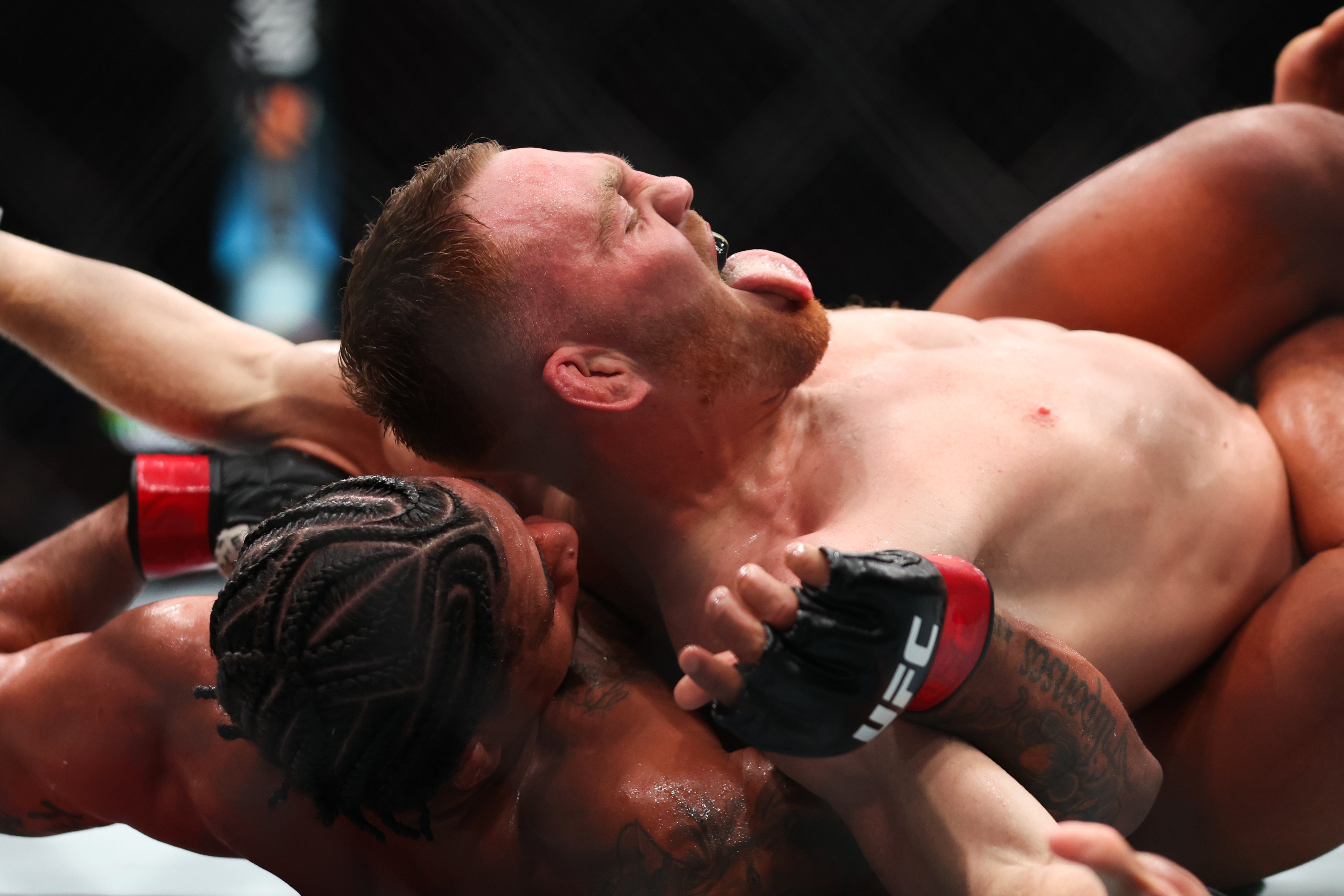 Jack Della Maddalena (top) during his fight with Gilbert Burns in March