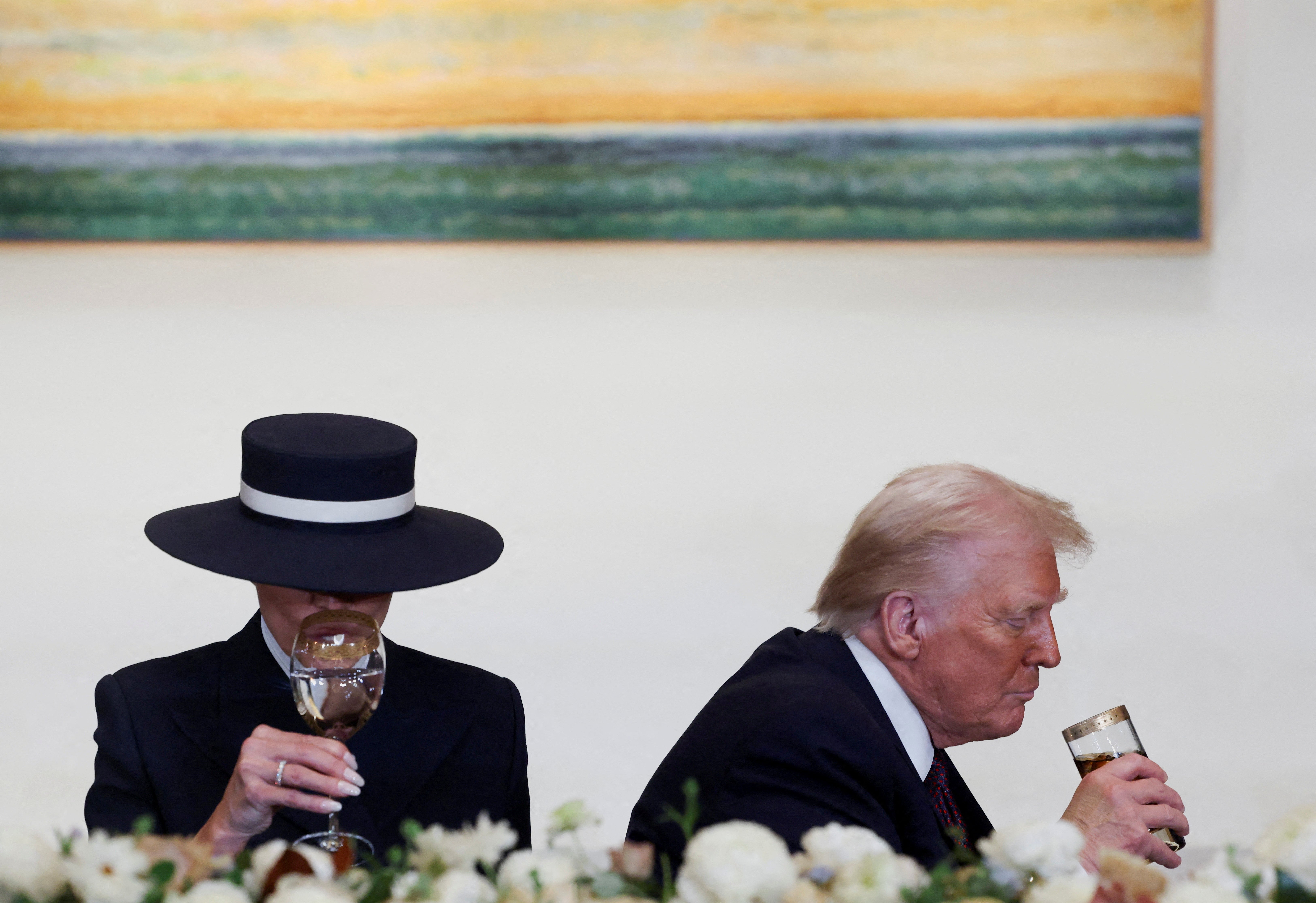 President Donald Trump drinks Diet Coke at his inaugural luncheon while Melania sips water