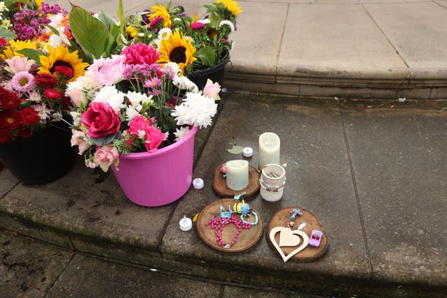 Flowers and tributes outside the Atkinson Art Centre Southport for the three girls (Paul Currie/PA)