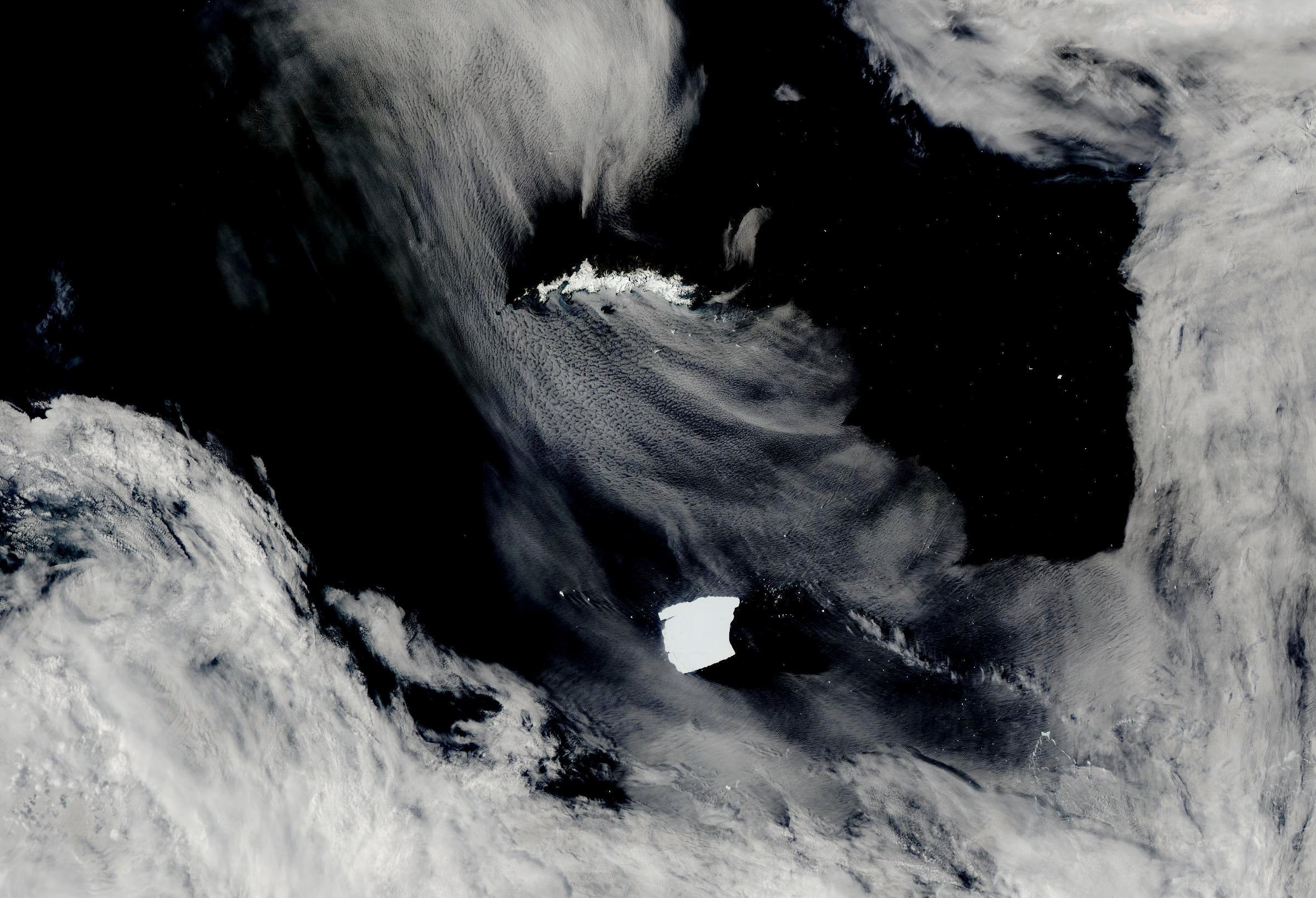 Aqua satellite, known as A23a, center, is visible as it heads toward South Georgia Island