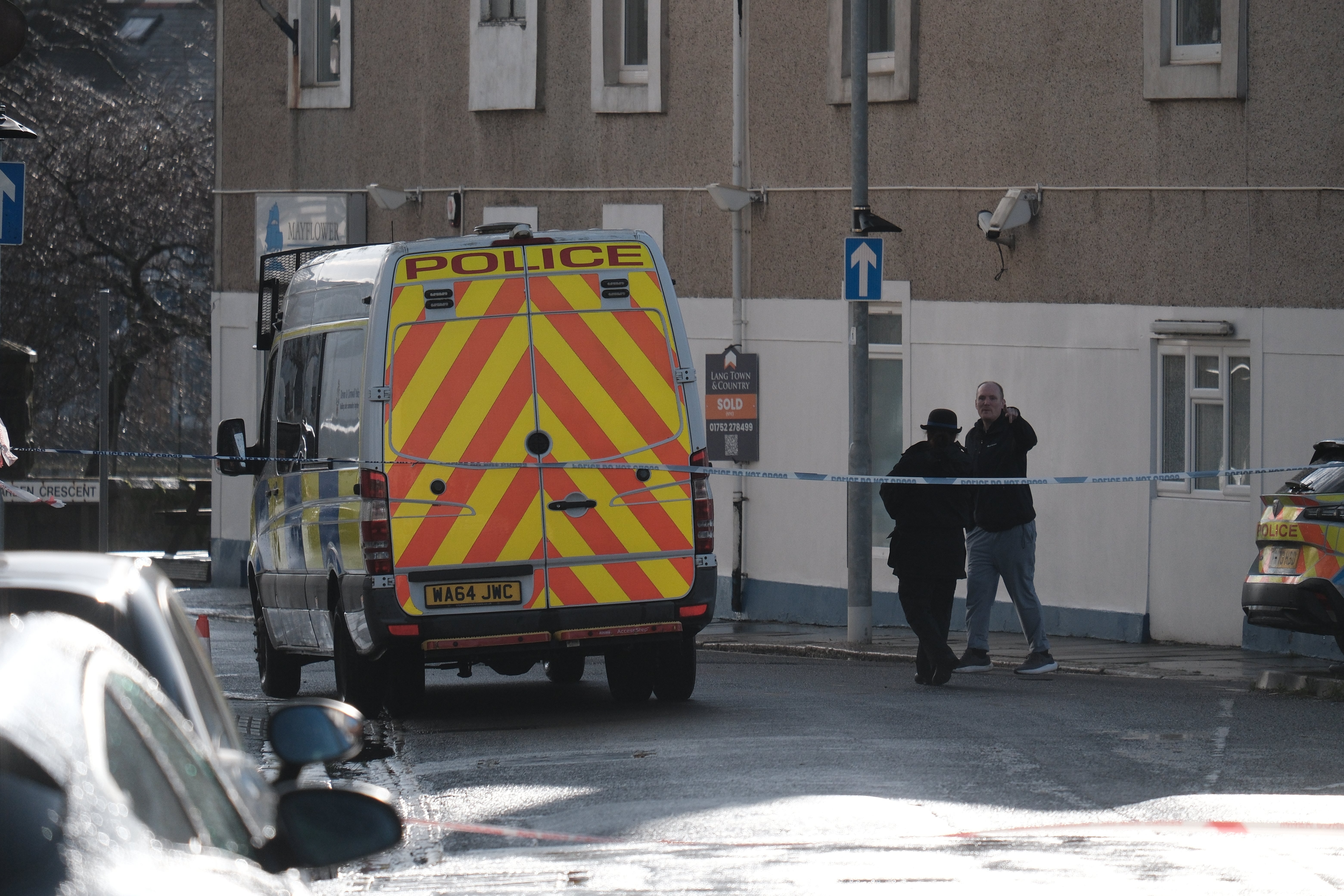 Paul Antony Butler, 53, has been arrested on suspicion of murder - the scene where the woman was found in Plymouth