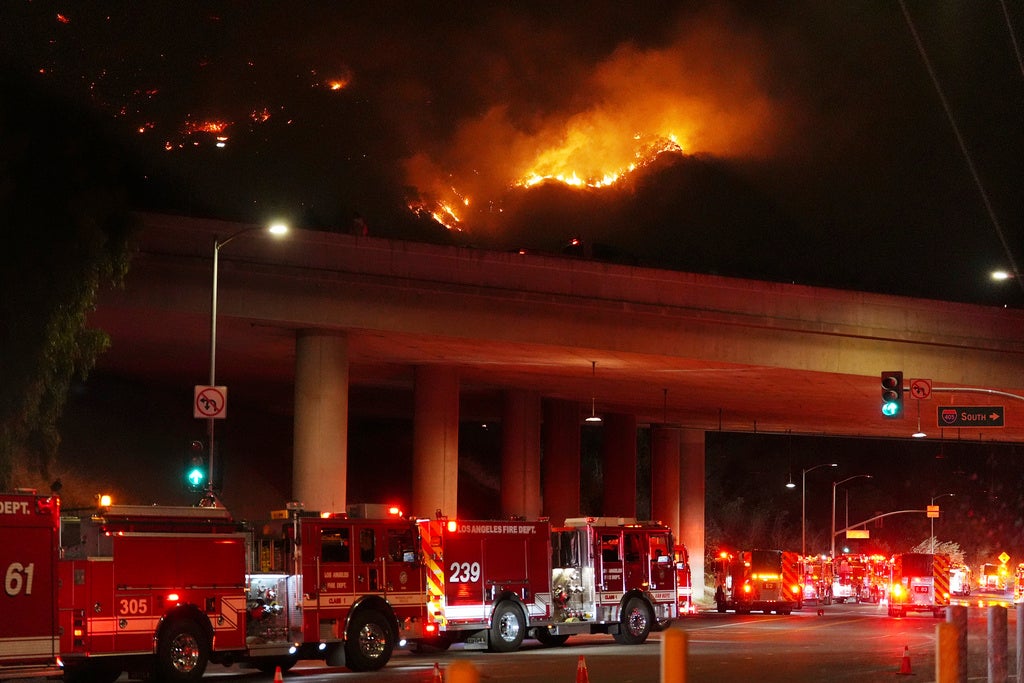 Apparatus sits on Sepulveda Blvd. as fire burns along Interstate 405, Thursday, Jan. 23, 2025, in Los Angeles