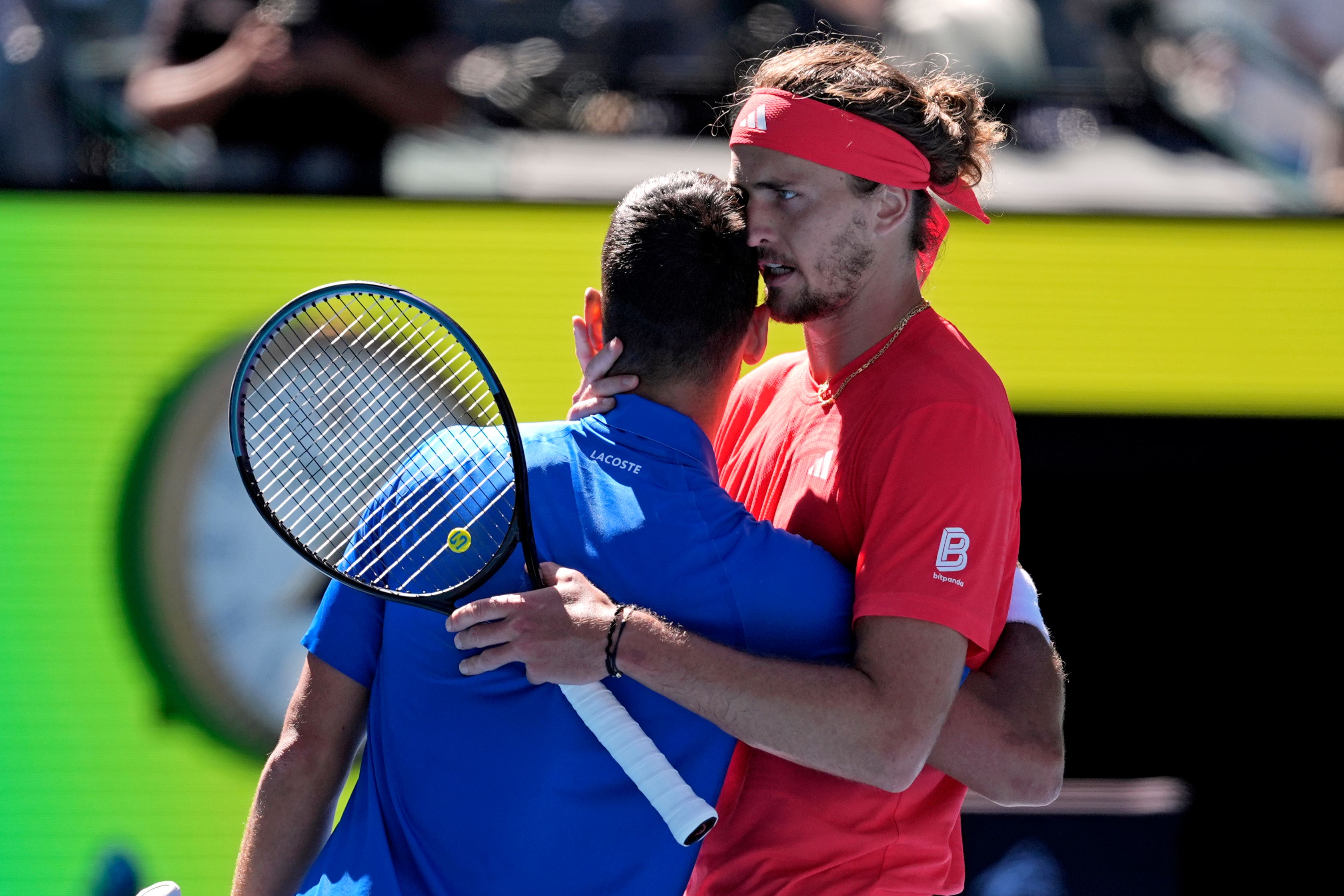 Alexander Zverev embraces Novak Djokovic after retirement