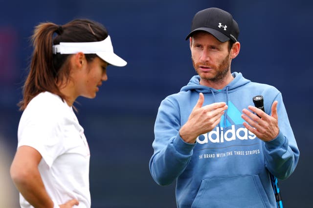 Nick Cavaday, right, talks to Emma Raducanu (Mike Egerton/PA)