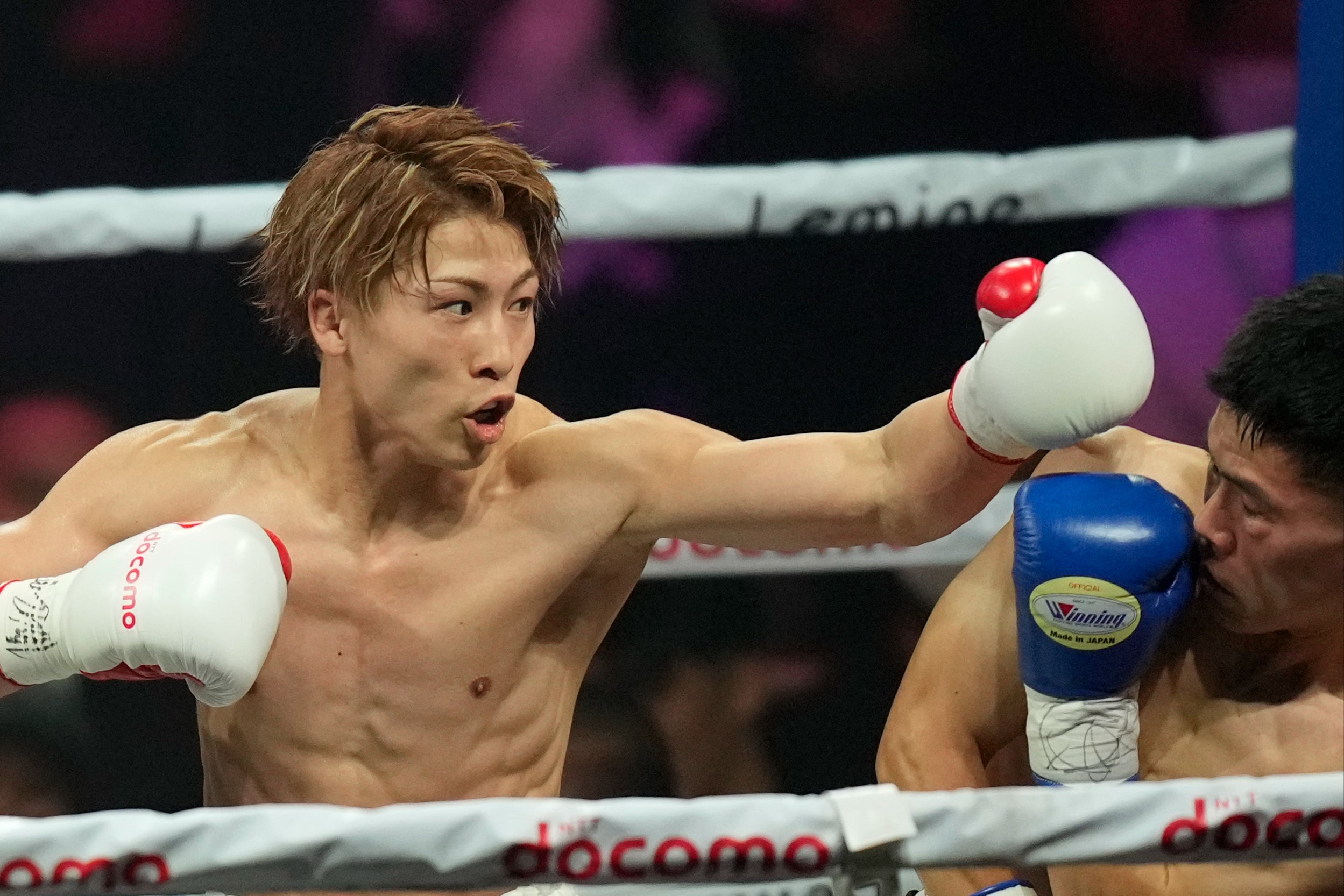 Naoya Inoue (left) pushes the pace against Ye Joon Kim