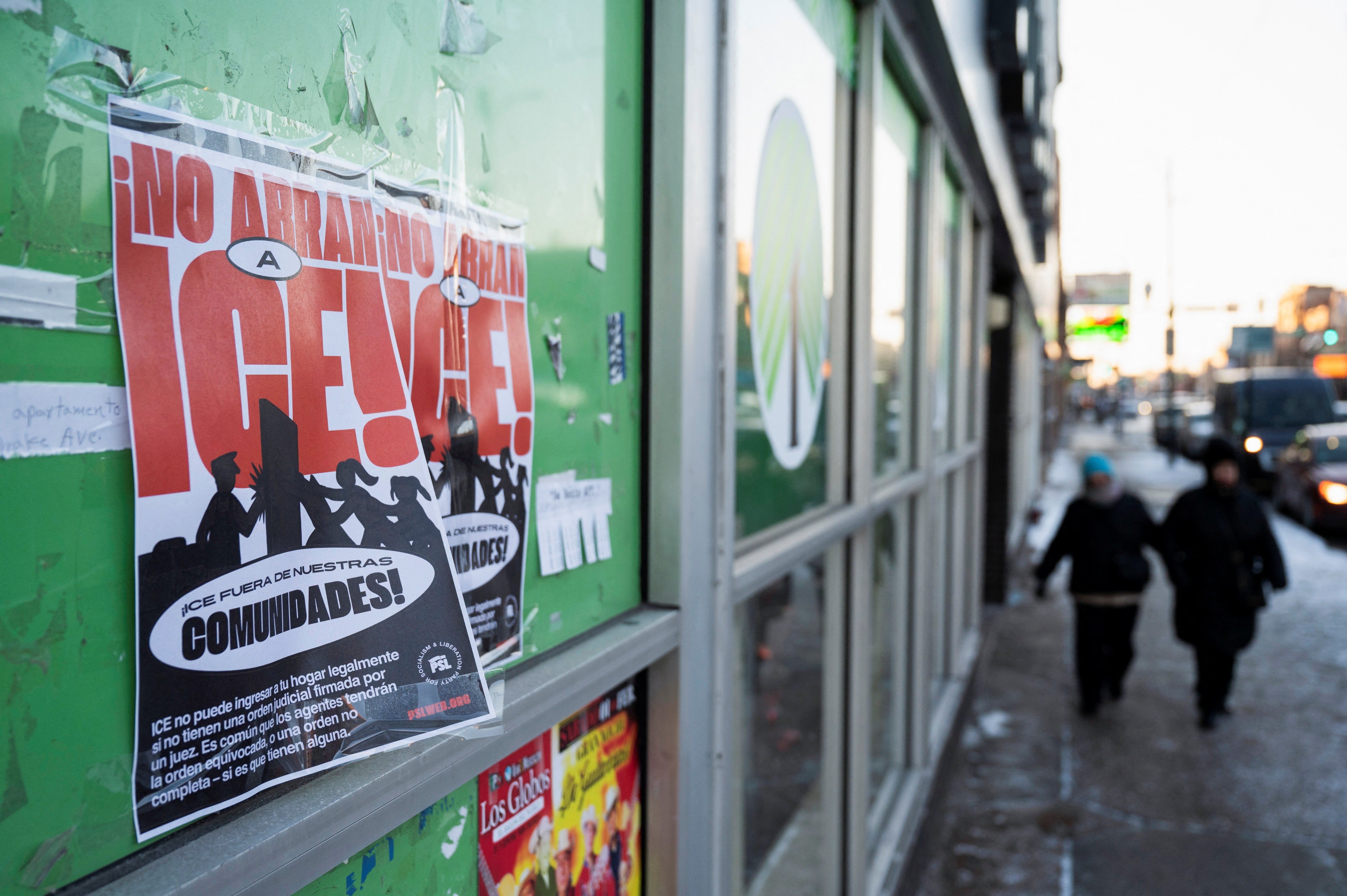 Signage opposing Immigration and Customs Enforcement appeared in Chicago’s Little Mexico neighborhood, one of many communities across the country bracing for Trump’s immigration actions