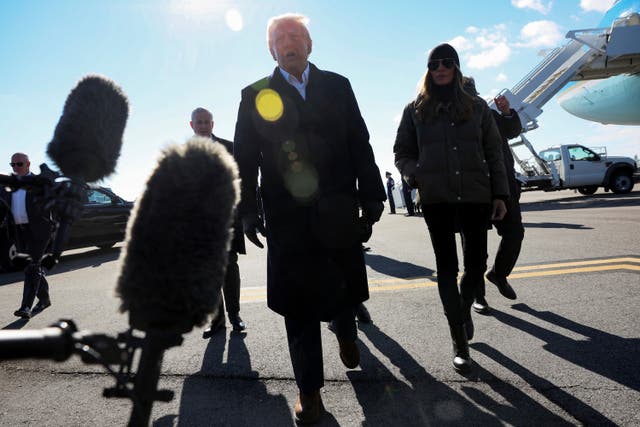 <p>U.S. President Donald Trump speaks to the media next to first lady Melania Trump as he arrives to assess recovery efforts and tour areas devastated by Hurricane Helene in Asheville, North Carolina</p>