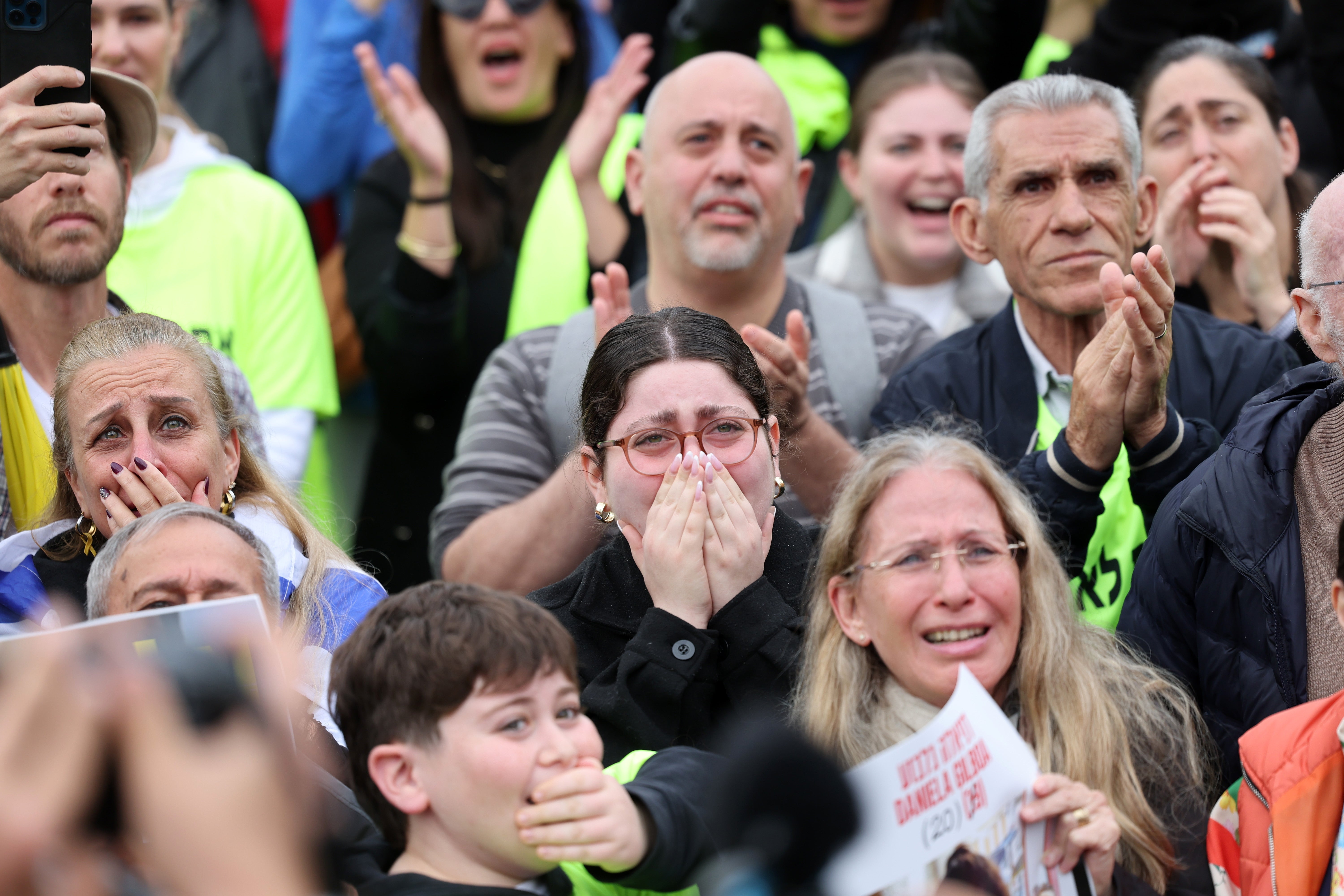 In Hostages Square, relatives of the captives and their supporters cry, clap and hug each other