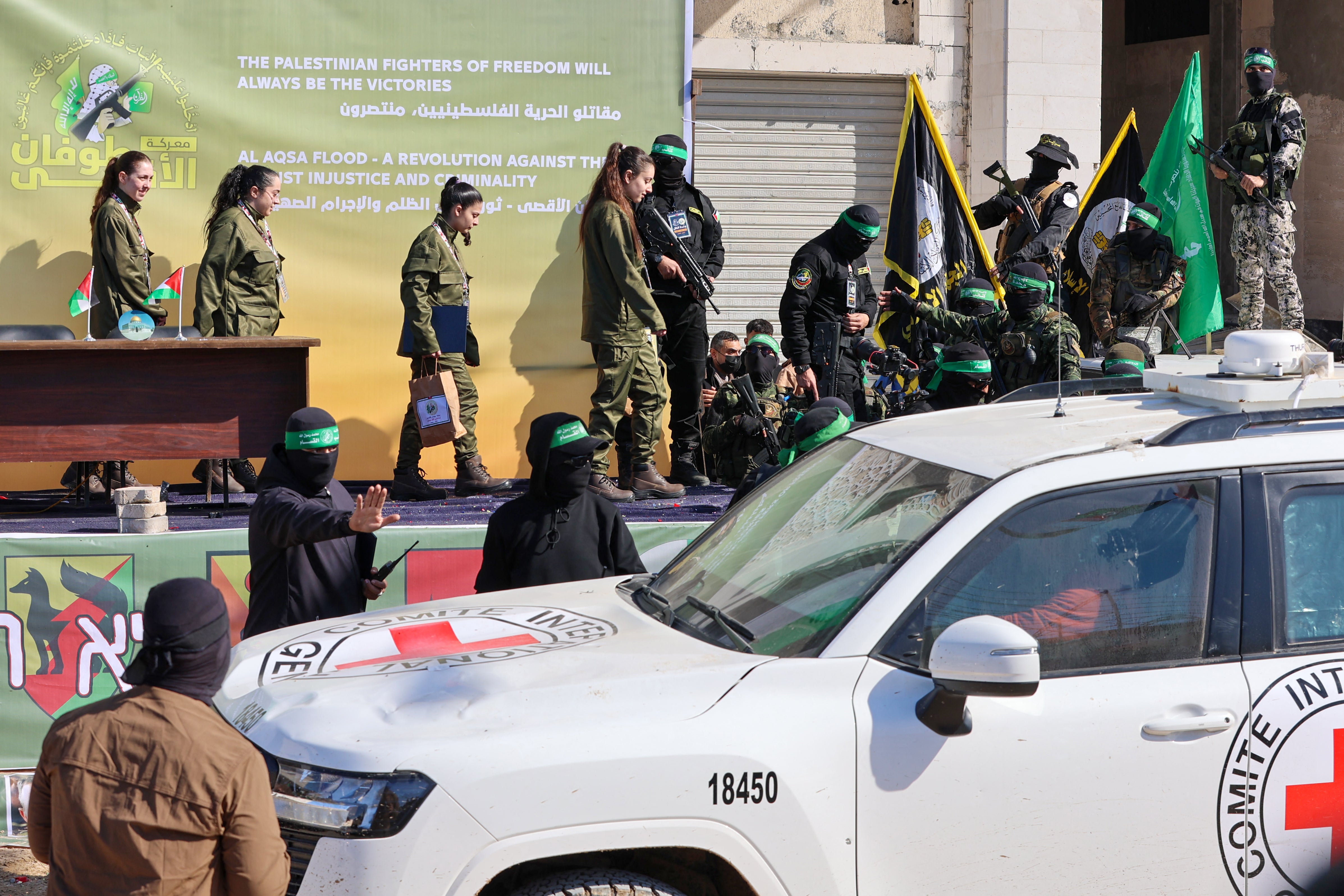 The militants set up a podium in Palestine Square where representatives of the International Committee of the Red Cross signed documents confirming the handover, as thousands cheered