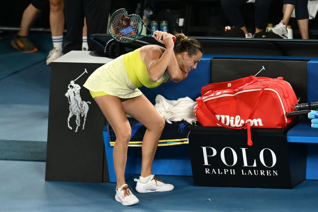 Aryna Sabalenka throws her smashed racket after her defeat by Madison Keys