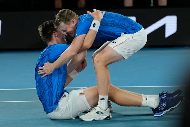 Harri Heliovaara, right, and Henry Patten celebrate their Australian Open victory (Ng Han Guan/AP)