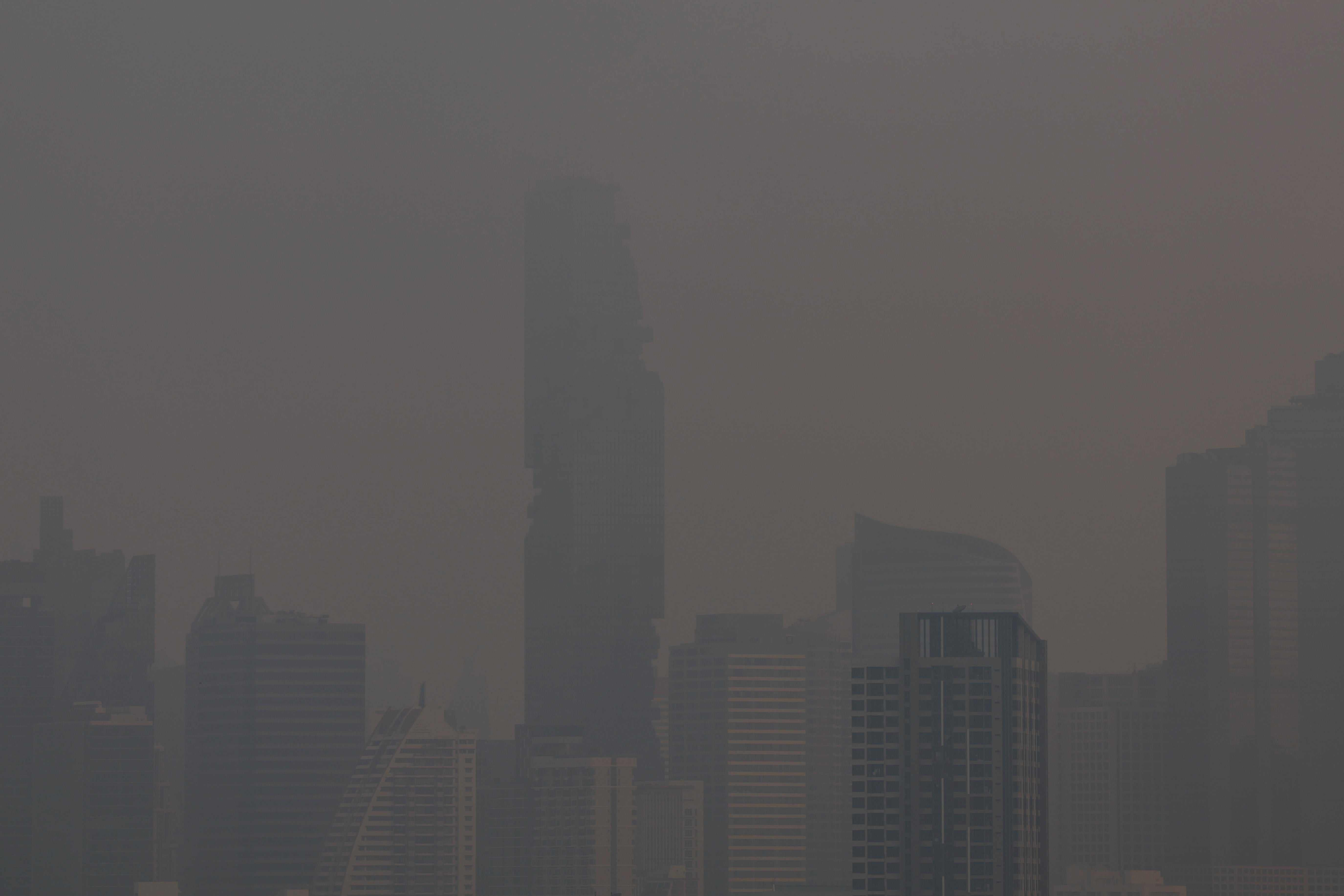 A view of the city amid air pollution after sunrise, in Bangkok