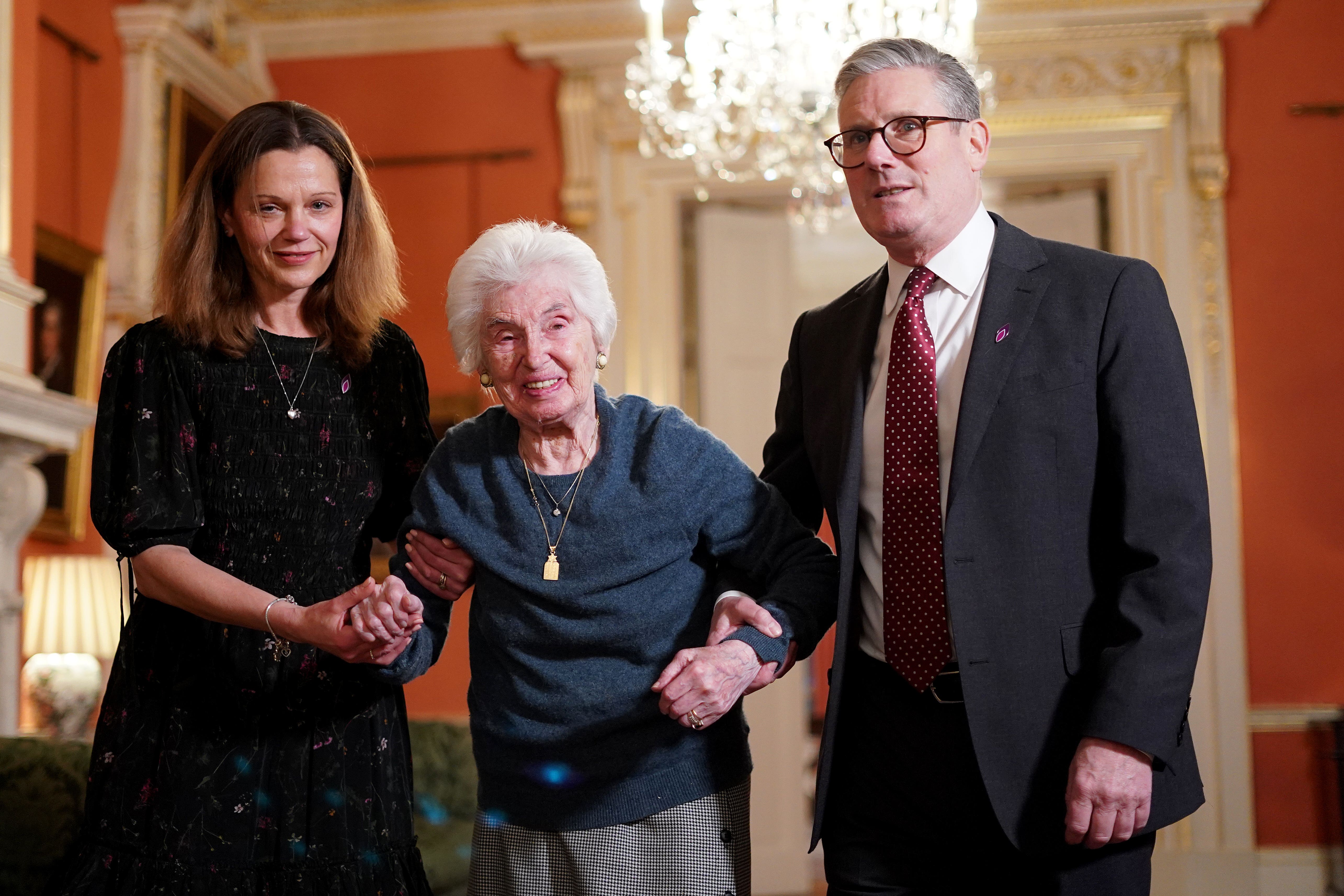 Prime Minister Sir Keir Starmer and his wife Lady Victoria help Holocaust survivor Renee Salt during a reception to mark Holocaust Memorial Day at 10 Downing Street (Alberto Pizzoli/PA)