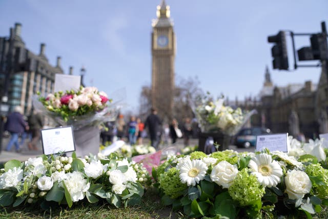 Foral tributes left in Parliament Square, London, to mark the fifth anniversary of the Westminster Bridge terror attack (Kirsty O’Connor/PA)