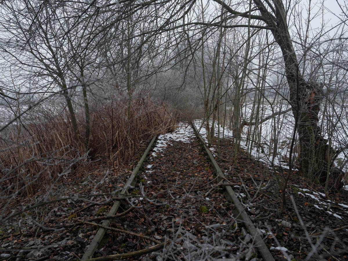 AP PHOTOS: The rail tracks of Auschwitz still cross the area as aging reminders of horror