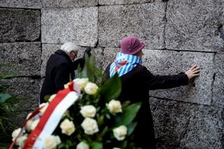 Survivors and relatives attend a ceremony at the Auschwitz-Birkenau former Nazi German concentration and extermination camp, in Oswiecim, Poland