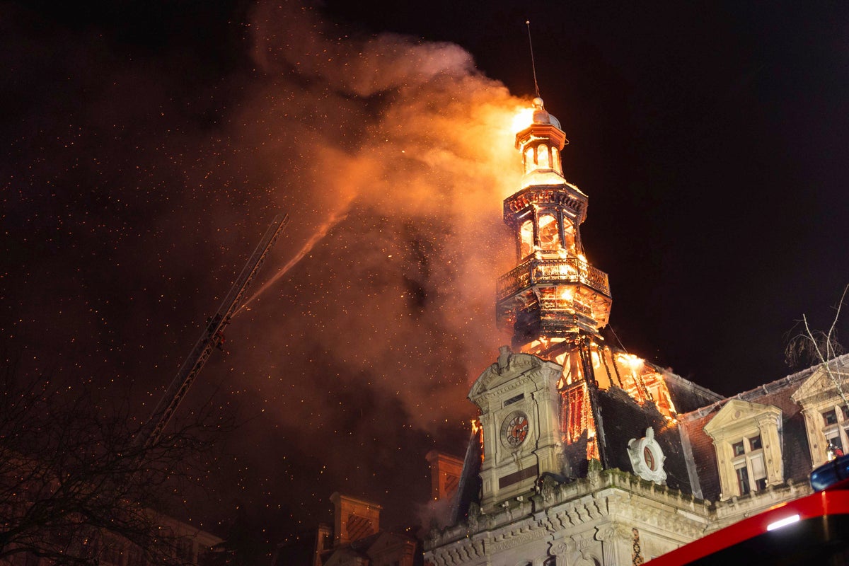 Fire damages a 19th century district town hall in Paris, leaving the bell tower at risk of collapse