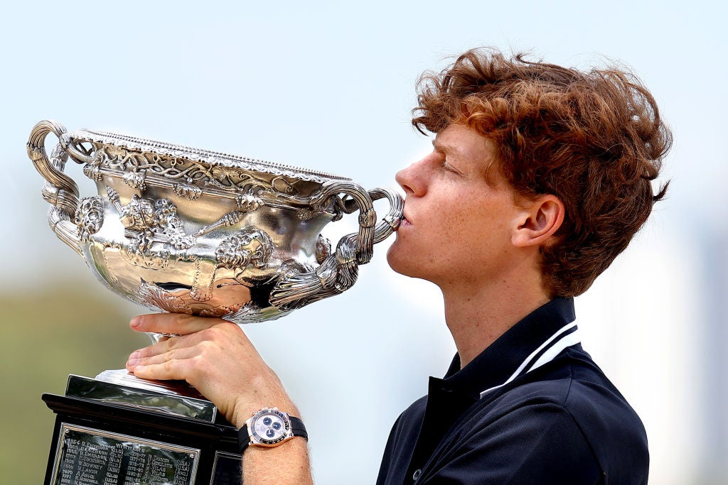 Jannik Sinner poses with the Norman Brookes Challenge Cup after his Australian Open victory