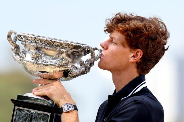 <p>Jannik Sinner poses with the Norman Brookes Challenge Cup after his Australian Open victory </p>