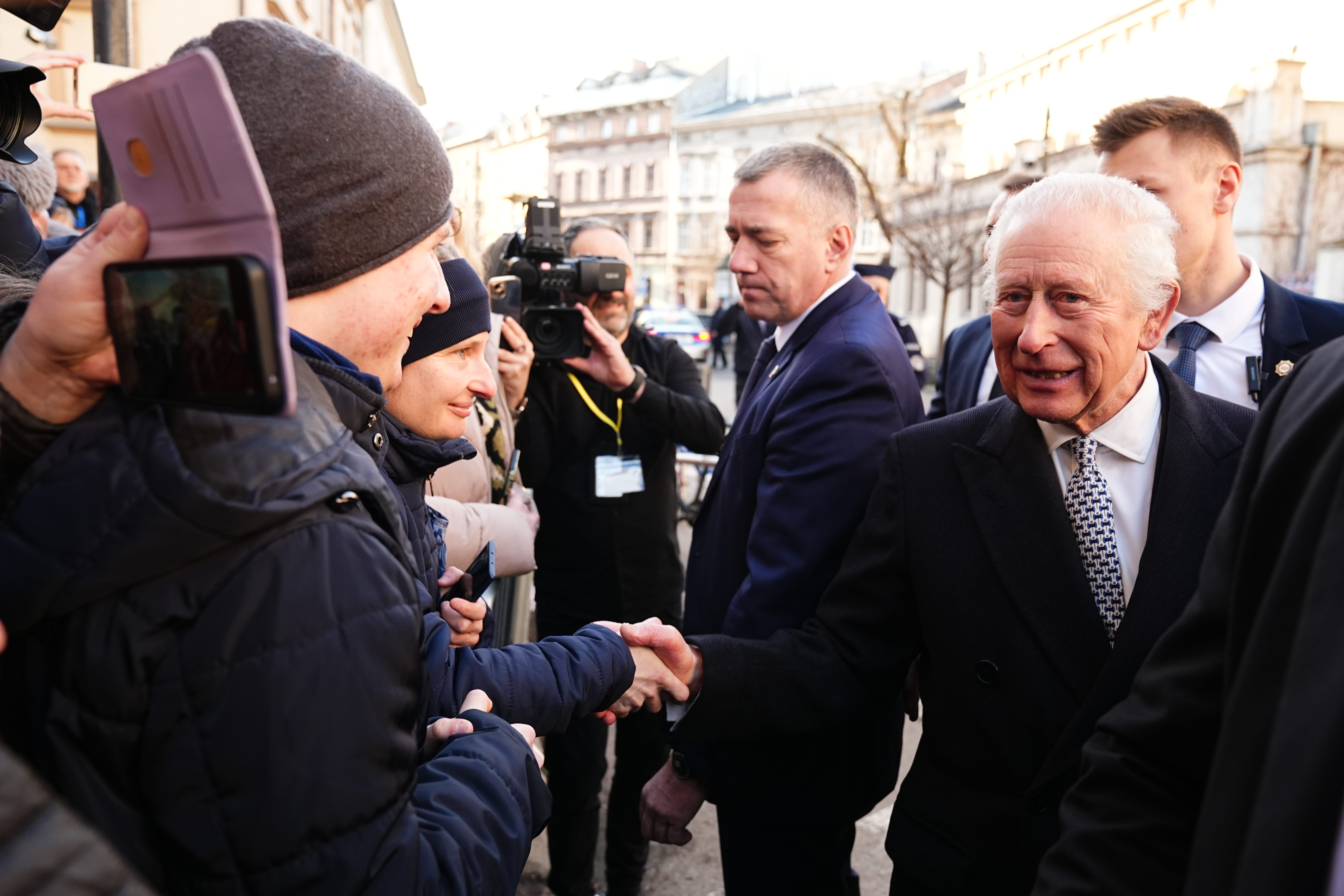 Charles greeted dozens of well-wishers outside the Jewish Community Centre Krakow (Aaron Chown/PA)