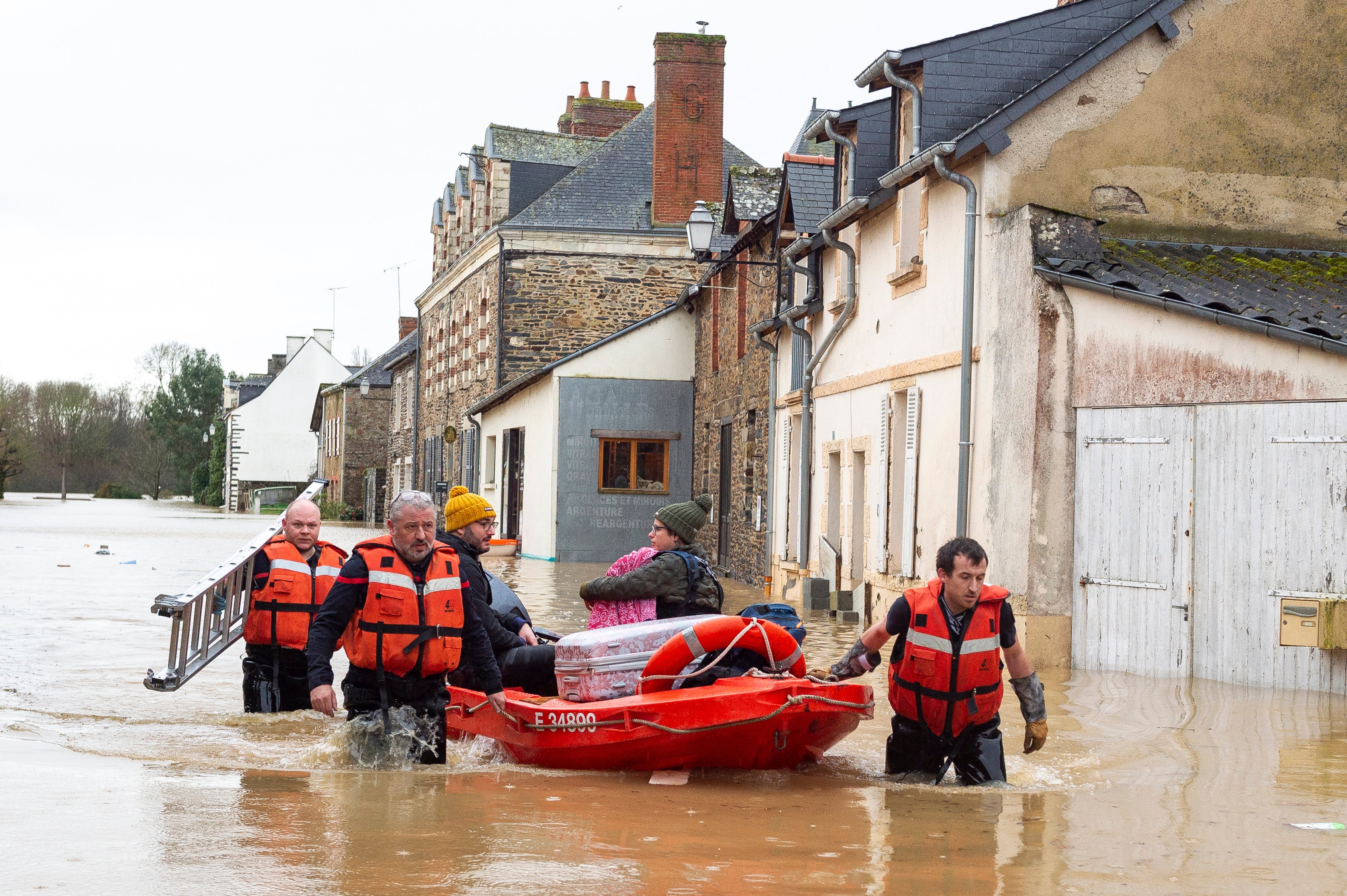 Rescue workers help residents in the village of Guipry Messac, France