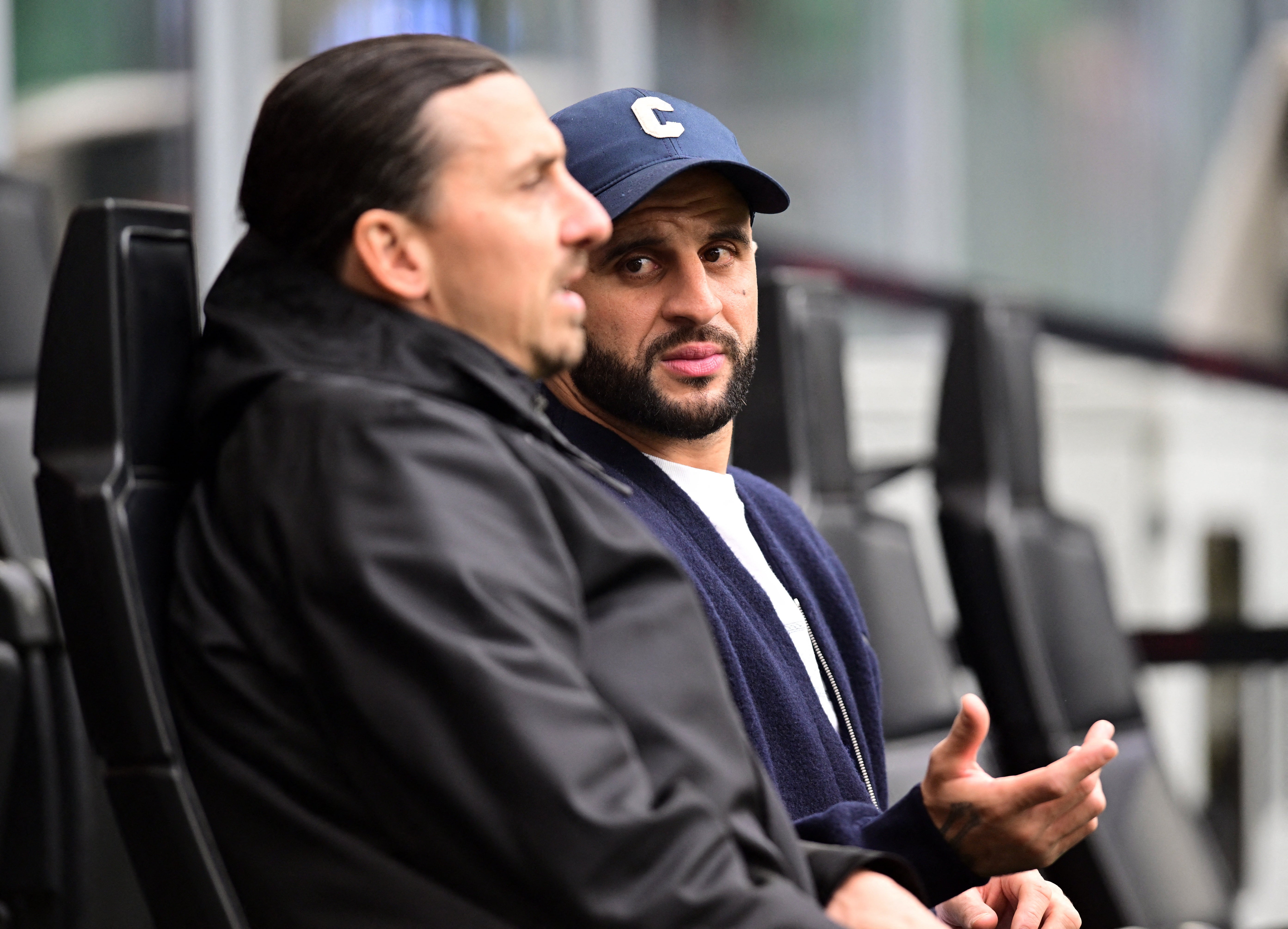 Kyle Walker in conversation with AC Milan's senior advisor Zlatan Ibrahimovic