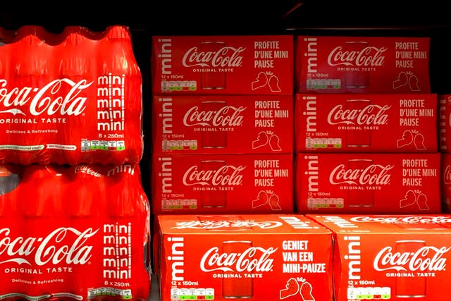 <p>Cleared cases of soft drinks sit on a shelf in a supermarket in Antwerp, Belgium</p>