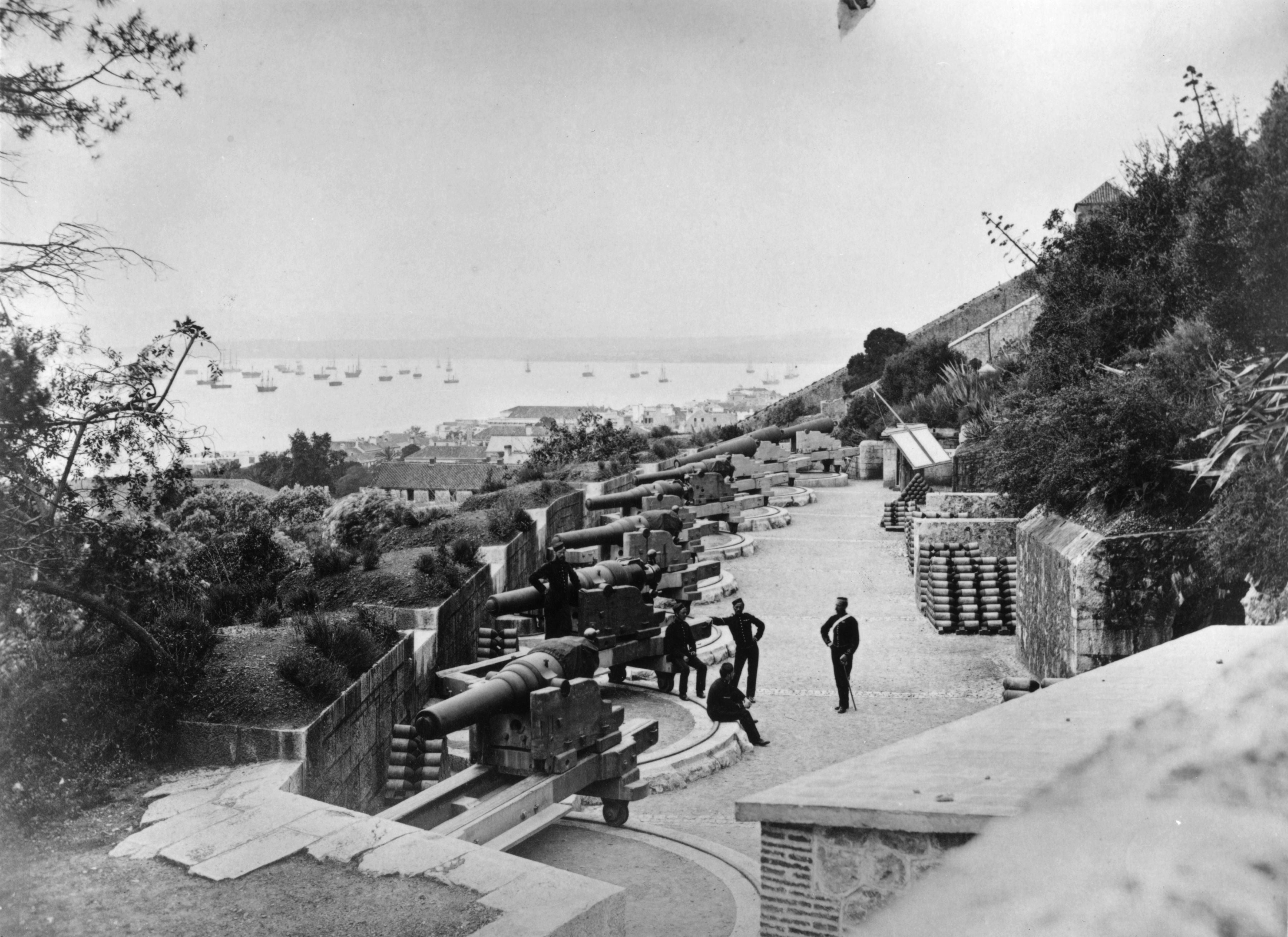 Soldiers pictured on a hillside terrace overlooking the harbour in Gibraltar, 1875