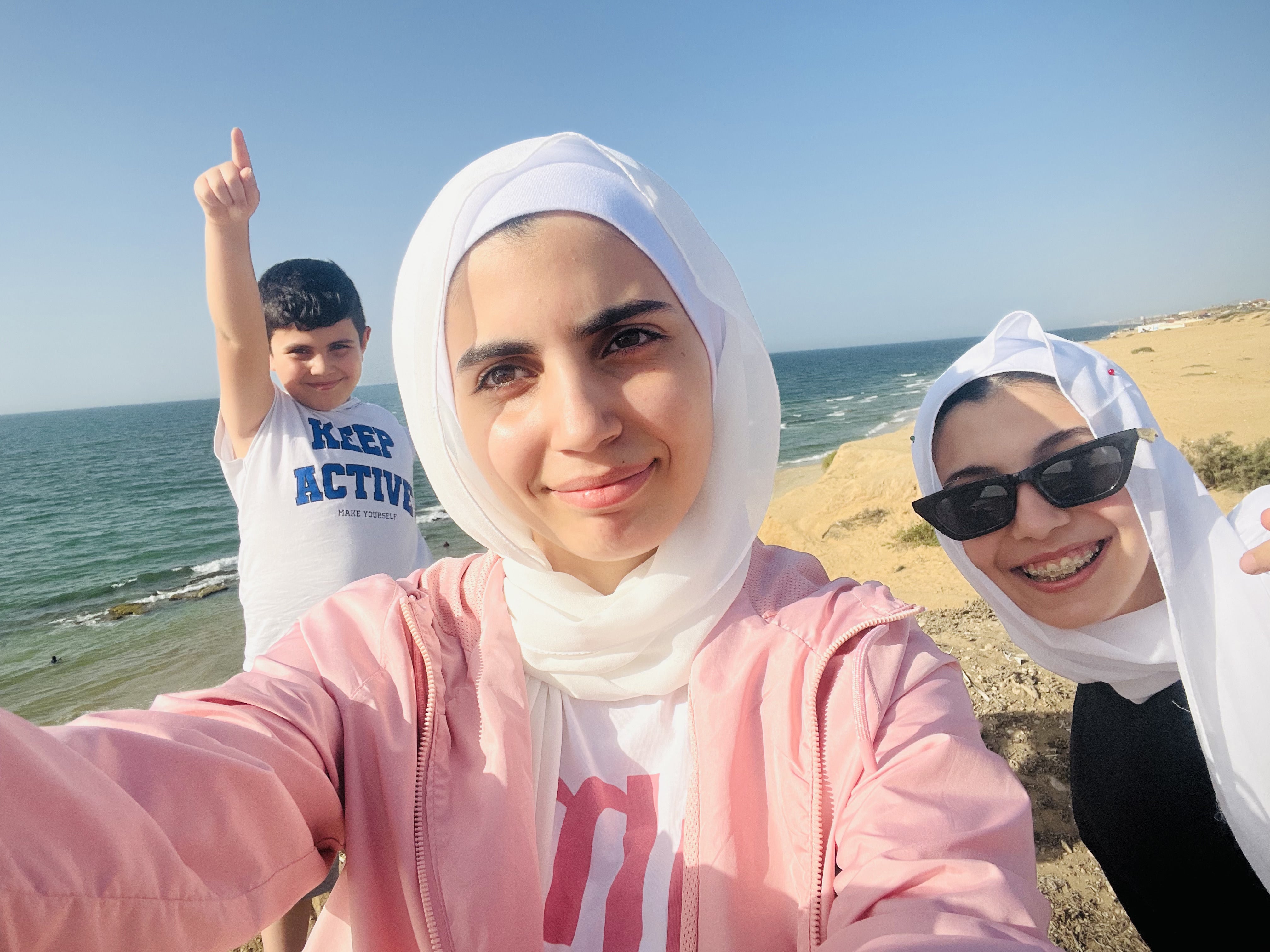 (R-L) Ayham, Hala and Nada on a family trip to a nearby beach soon before war broke out