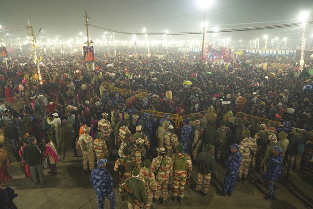 <p>Security officers stand guard at the site of a stampede on the Sangam, the confluence of the Ganges, the Yamuna and the mythical Saraswati rivers</p>