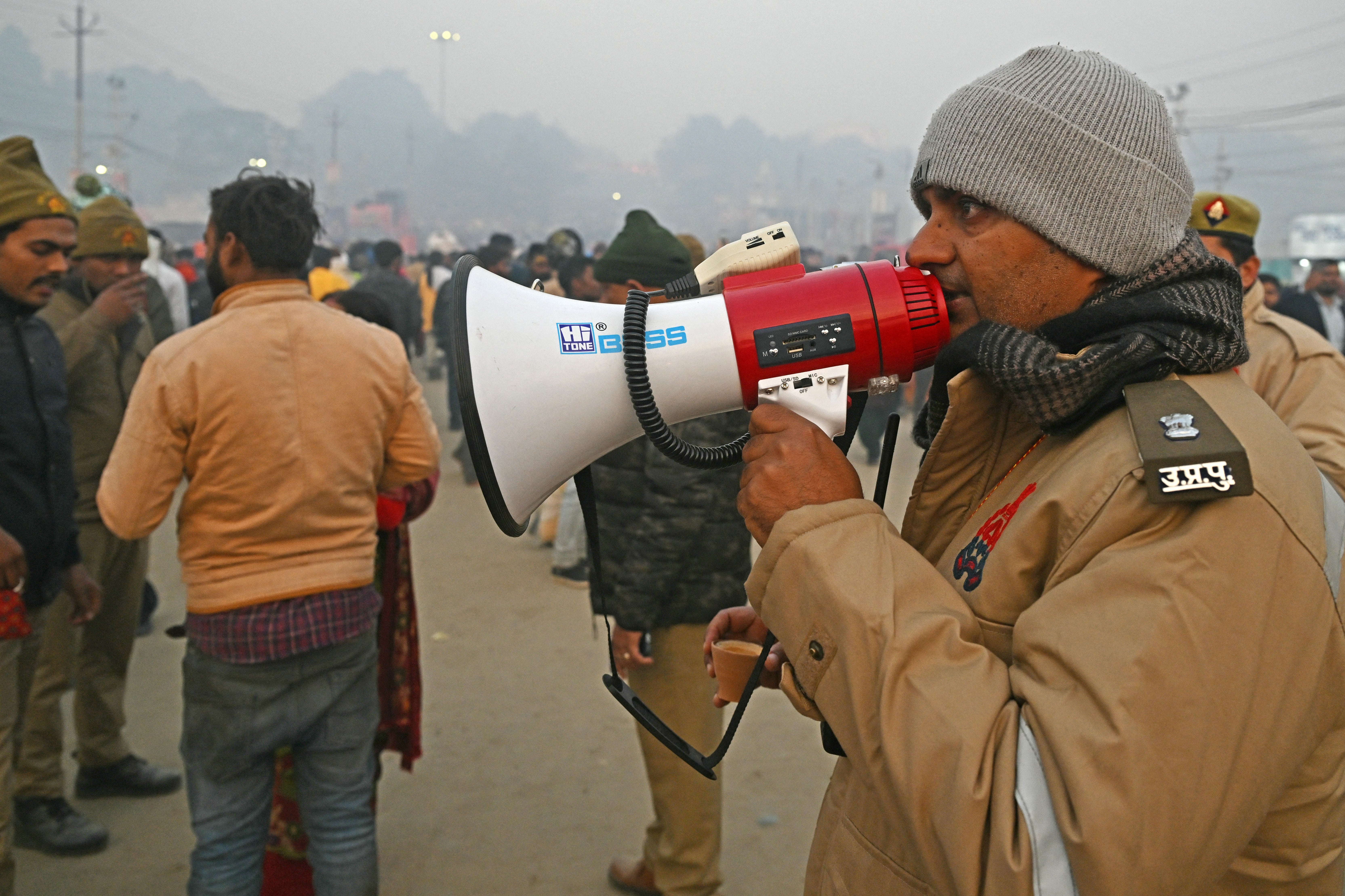 A policeman makes an announcement to modulate  the travel  of pilgrims astatine  Sangam connected  the juncture  of ‘Mauni Amavasya’ during the Maha Kumbh Mela festival successful  Prayagraj connected  29 January 2025