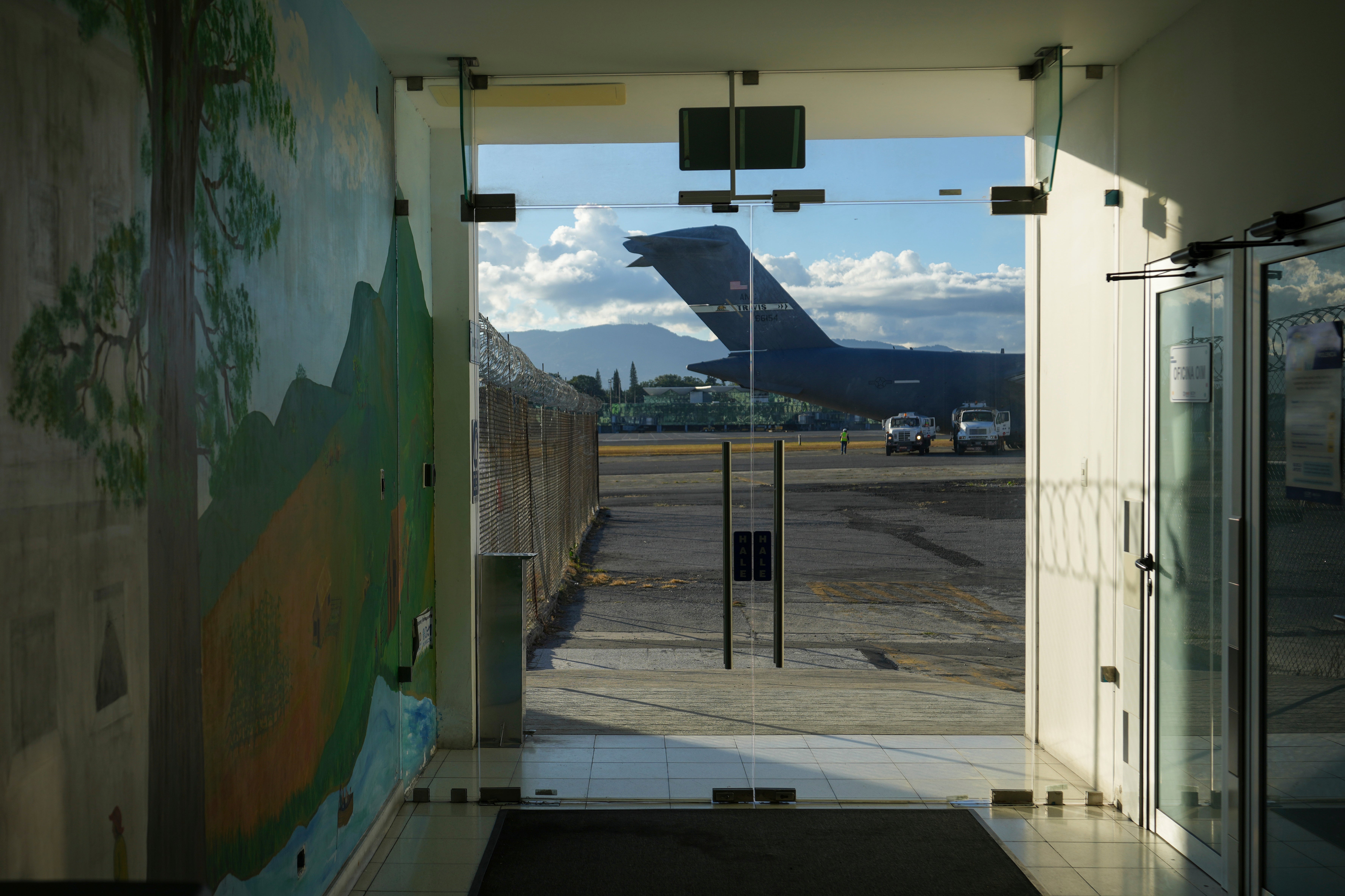 A US military plane carrying Guatemalan migrants deported from the United States sits on the tarmac at La Aurora airport in Guatemala City