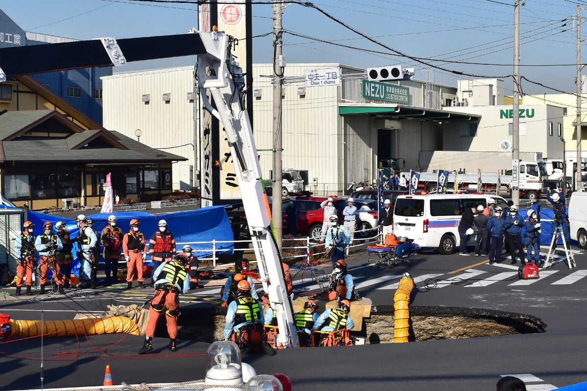 Truck driver disappears into swimming pool-sized sinkhole in middle of road