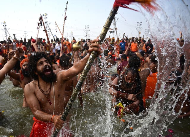 <p>Hindu ascetics take part in a sacred bathing ritual called Shahi Snan during the Kumbh Mela festival in Prayagraj in the northern Indian state of Uttar Pradesh on 29 January 2025</p>