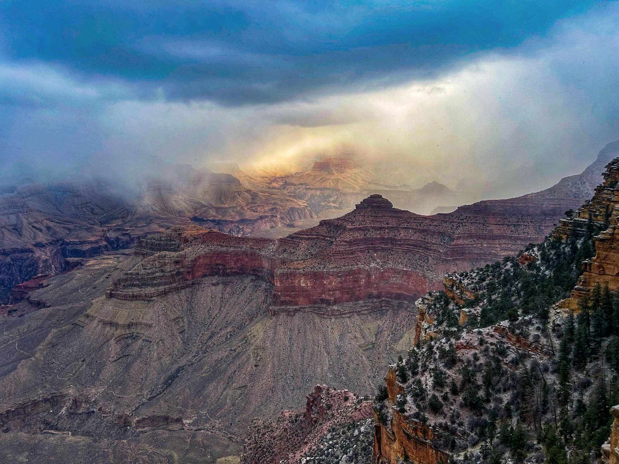 Snow is seen at Arizona’s Grand Canyon National Park on Tuesday. More light snow and rain is expected across the Southwest state on Wednesday as the system shifts eastward