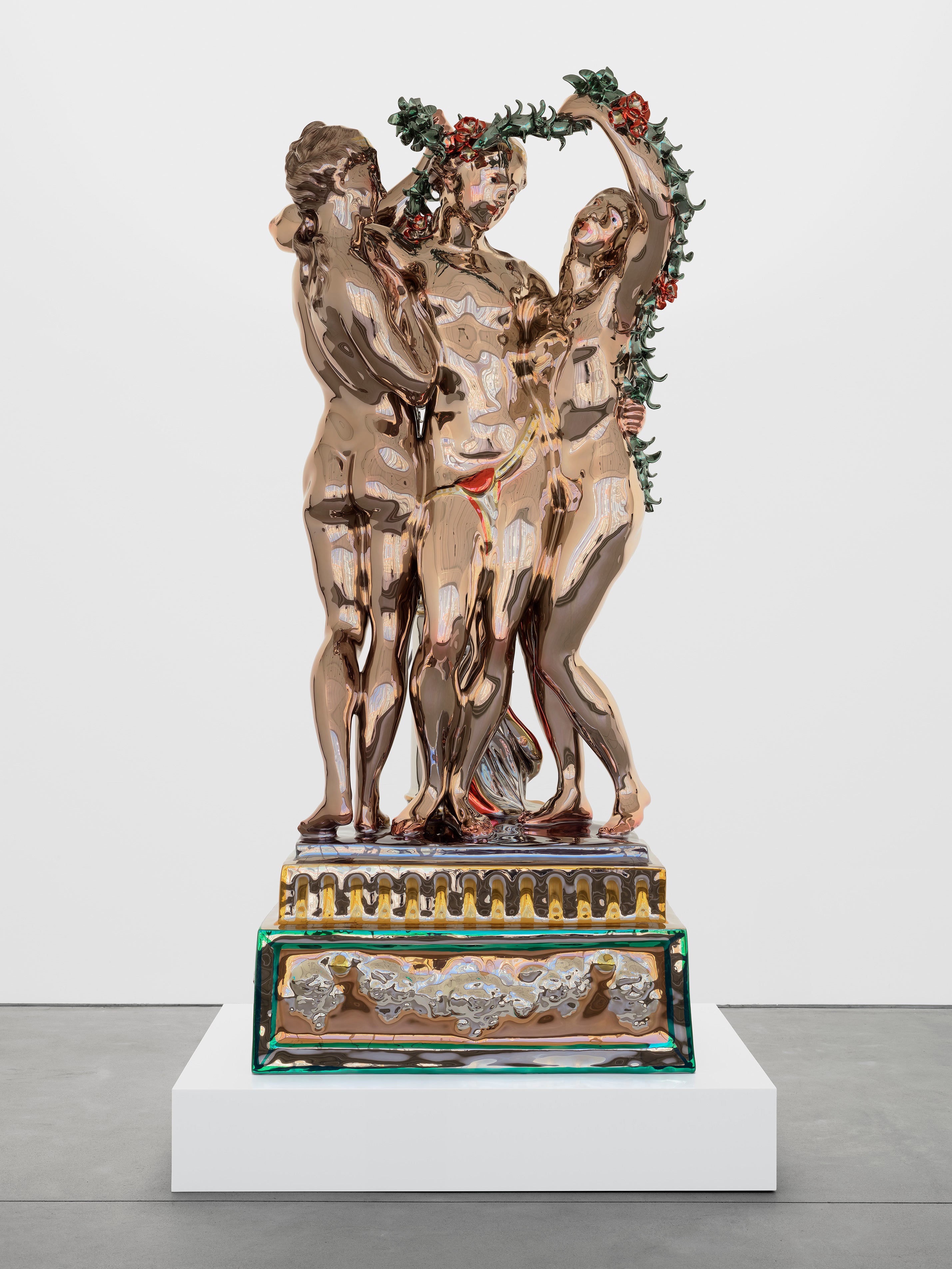 Koons’ The Three Graces , a sculpture of mirror-polished stainless steel with a transparent colour coating, stands over two metres tall