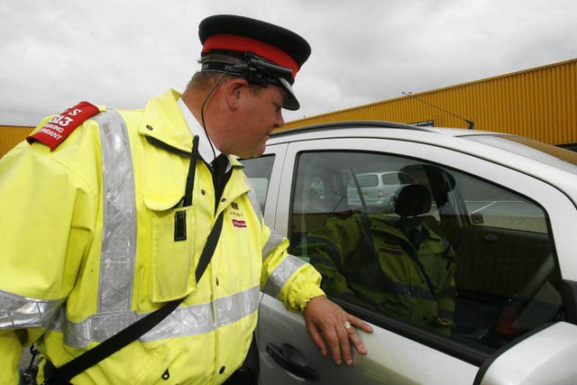 Under the proposed law, drivers could be fined by traffic wardens for parking their cars on pavements (Nigel Roddis/PA)