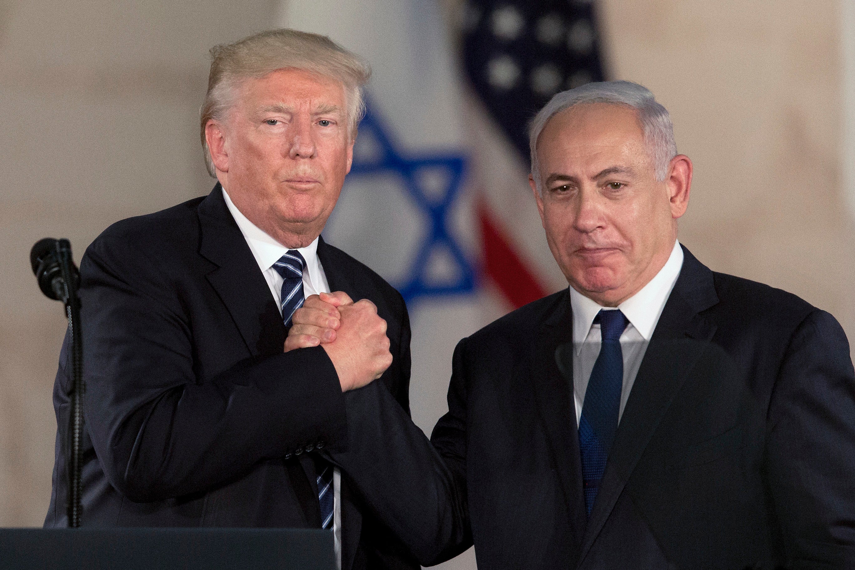 President Donald Trump and Israeli prime minister Benjamin Netanyahu shake hands at The Israel Museum in Jerusalem on 23 May, 2017