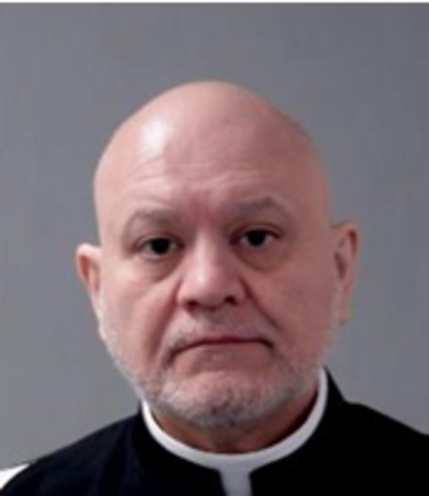 Detriot priest Carlos Martins was arrested after allegedly using a teenage girl's hair as floss