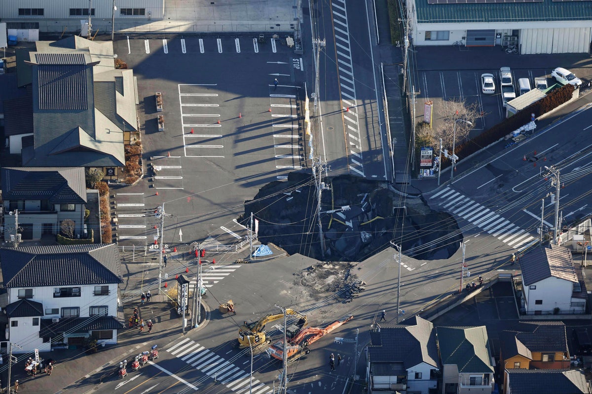 Japan tries to rescue man stuck in sinkhole. Here's what's going on.