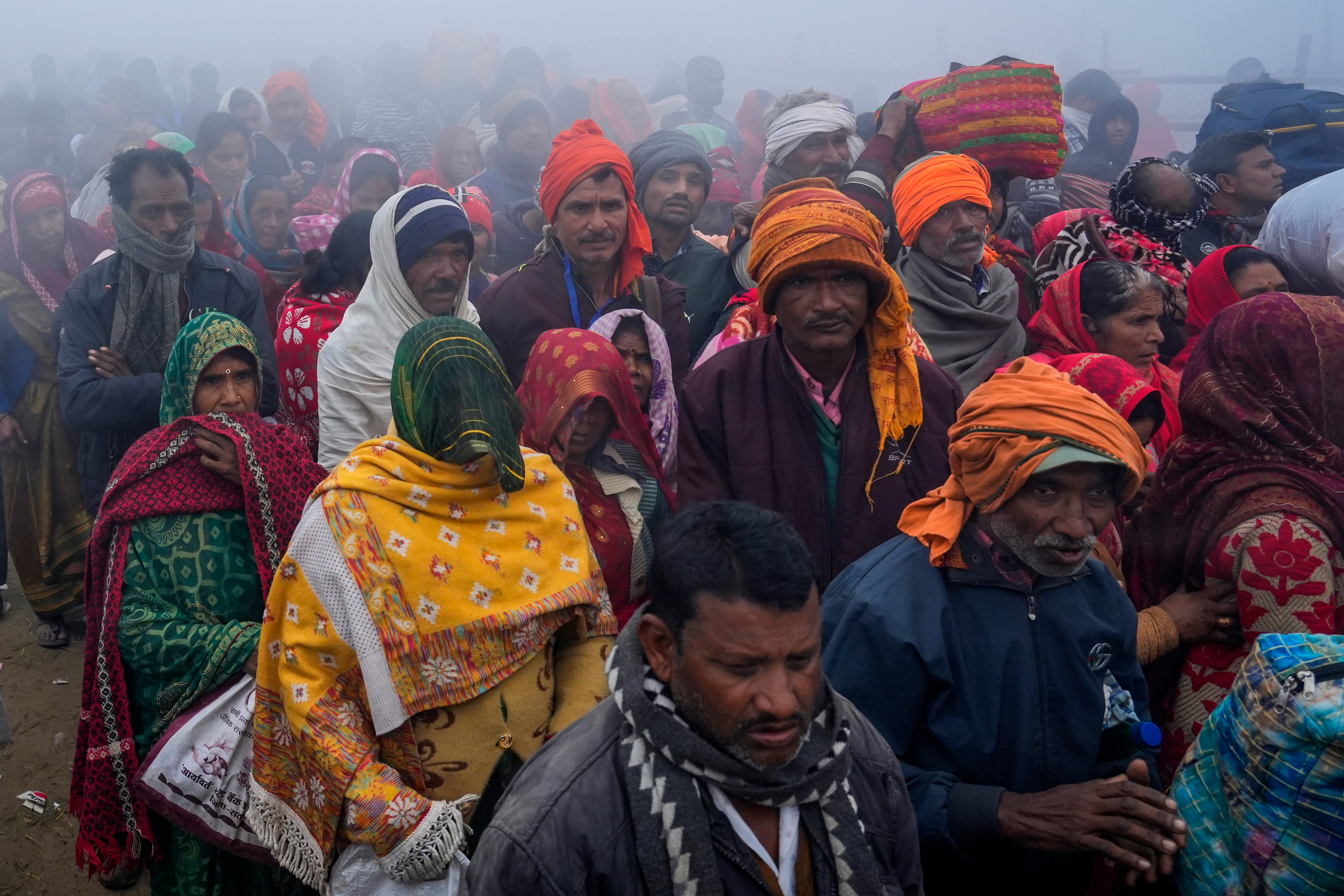 Hindu devotees arrive to take a holy dip at Sangam