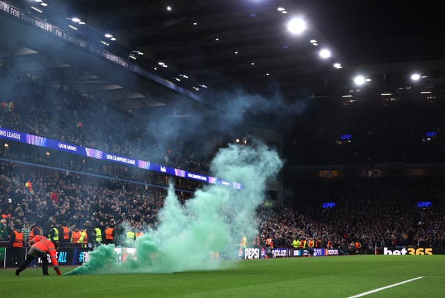 <p>A green smoke bomb was thrown onto the pitch</p>