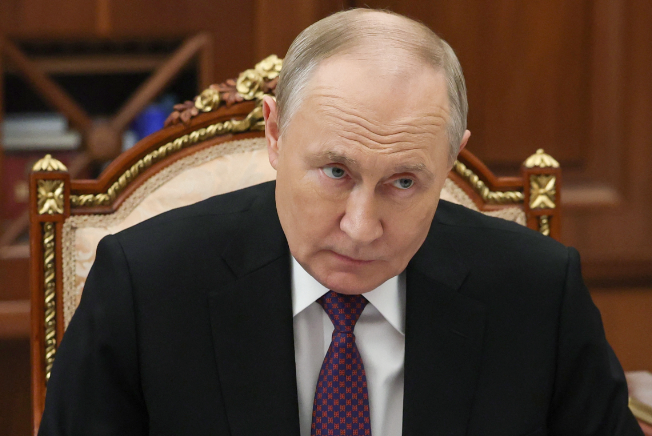 Russia's President Vladimir Putin attends a meeting with Transport Minister at the Kremlin
