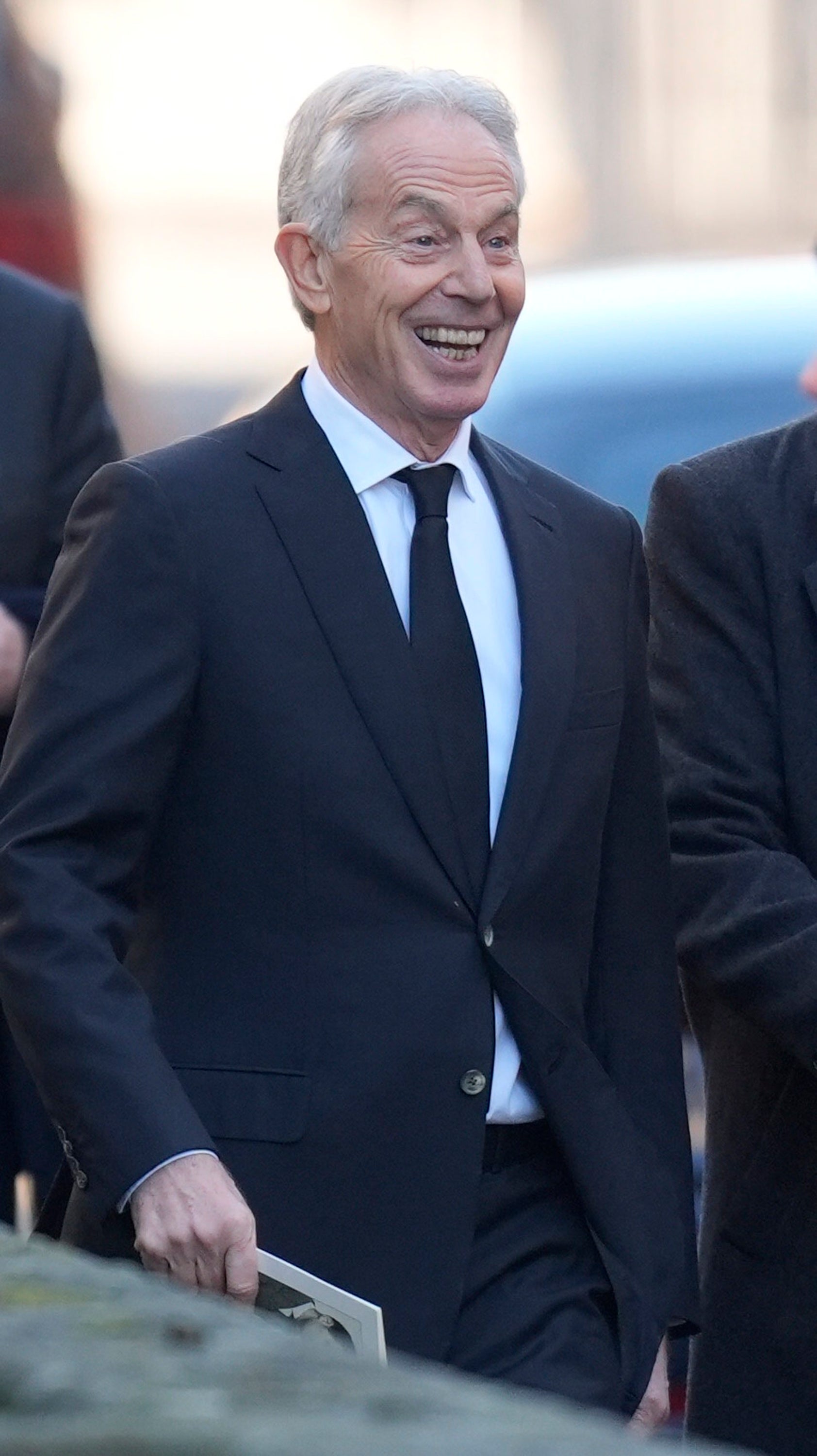 Sir Tony Blair leaves the funeral after his eulogy