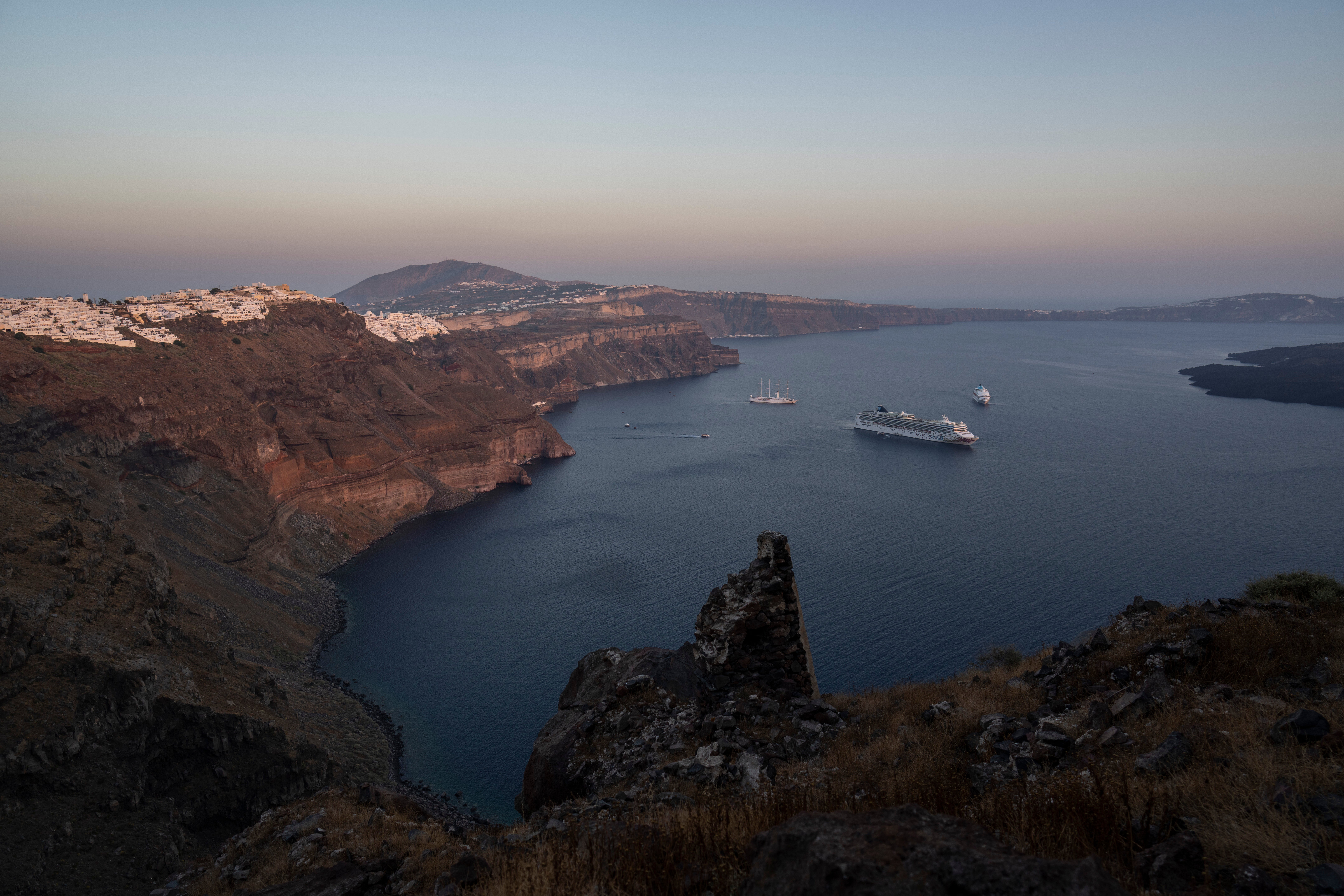 Ruins of a settlement, including a former Catholic monastery, lie on the rocky promontory of Skaros on the Greek island of Santorini