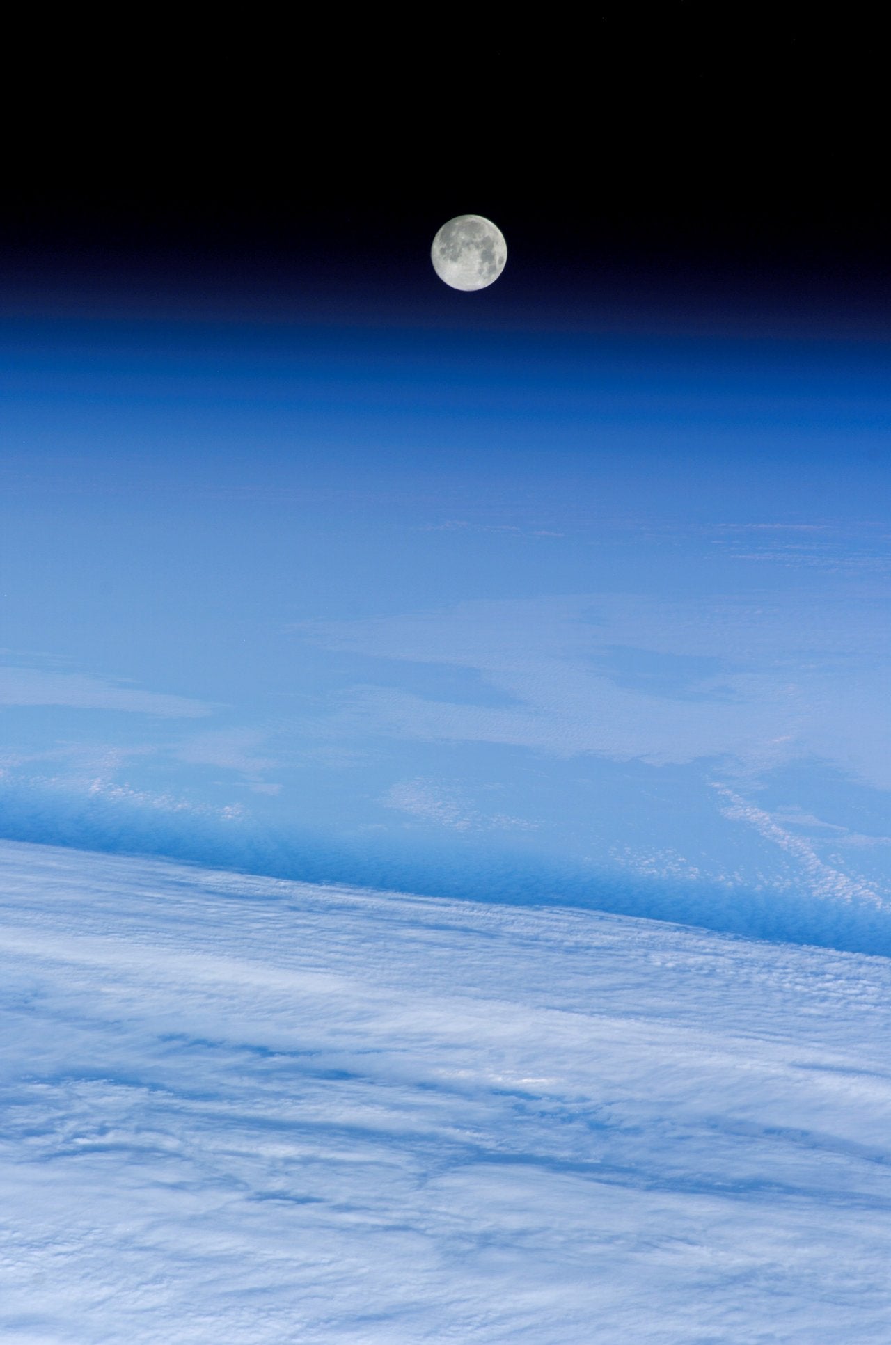 The snow moon rises over Earth, as seen by the International Space Station in February 2006. The moon is named for the month’s often snowy weather