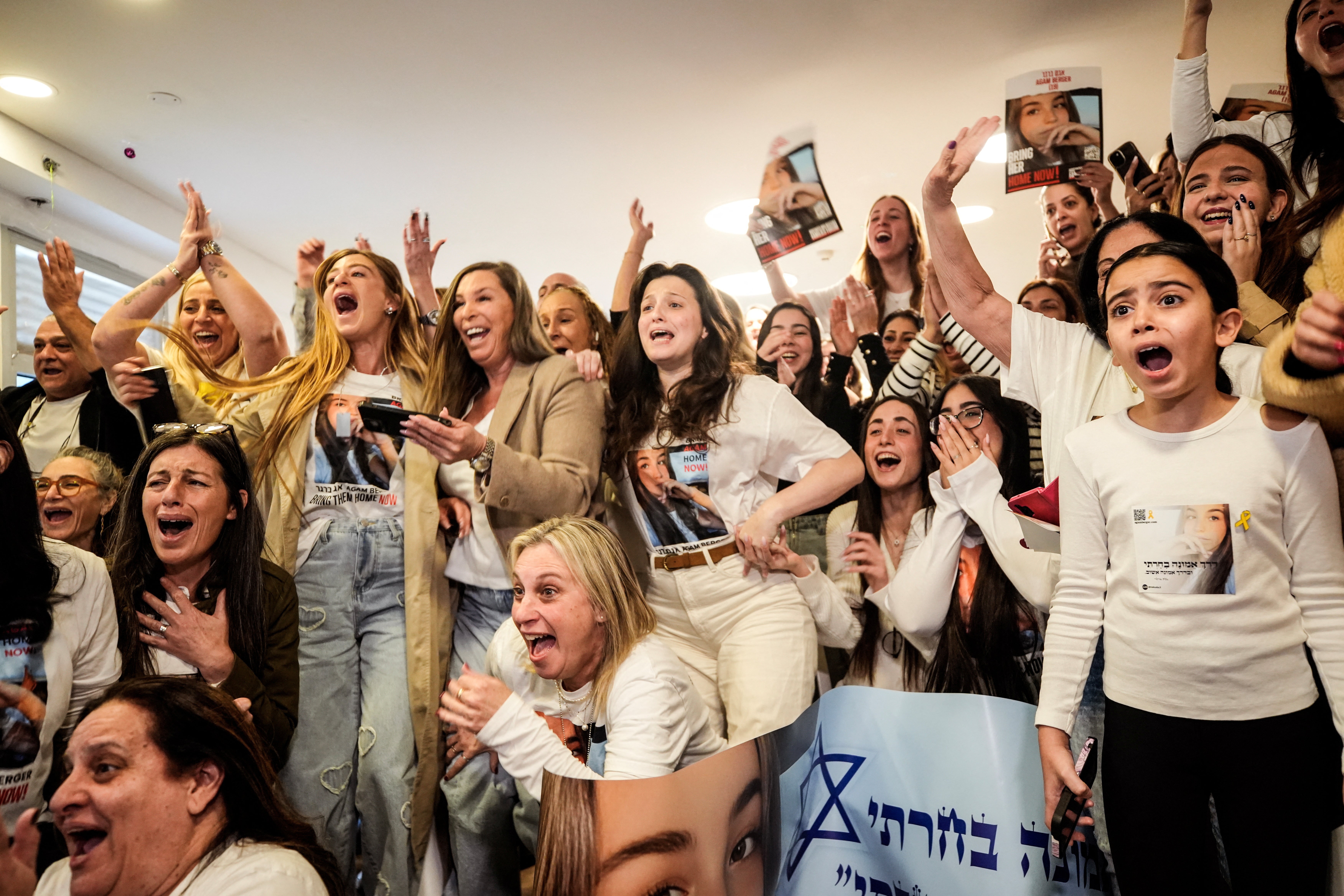 Family members and supporters of Israeli prisoners, Agam Berger, celebrate in Holon when she is released