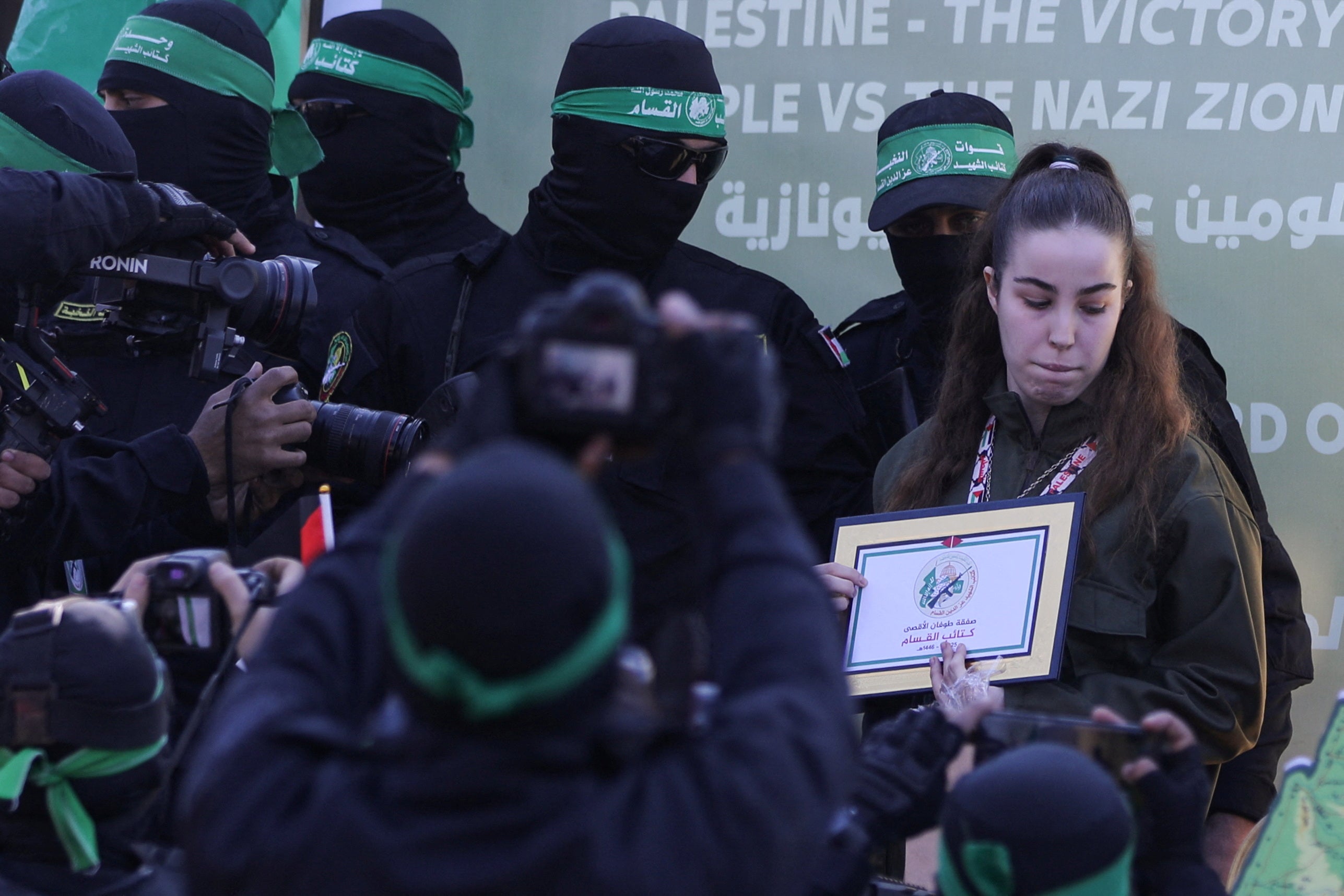 Agam Berger was flanked by dozens of Hamas militants as she was released in Jabalia, northern Gaza