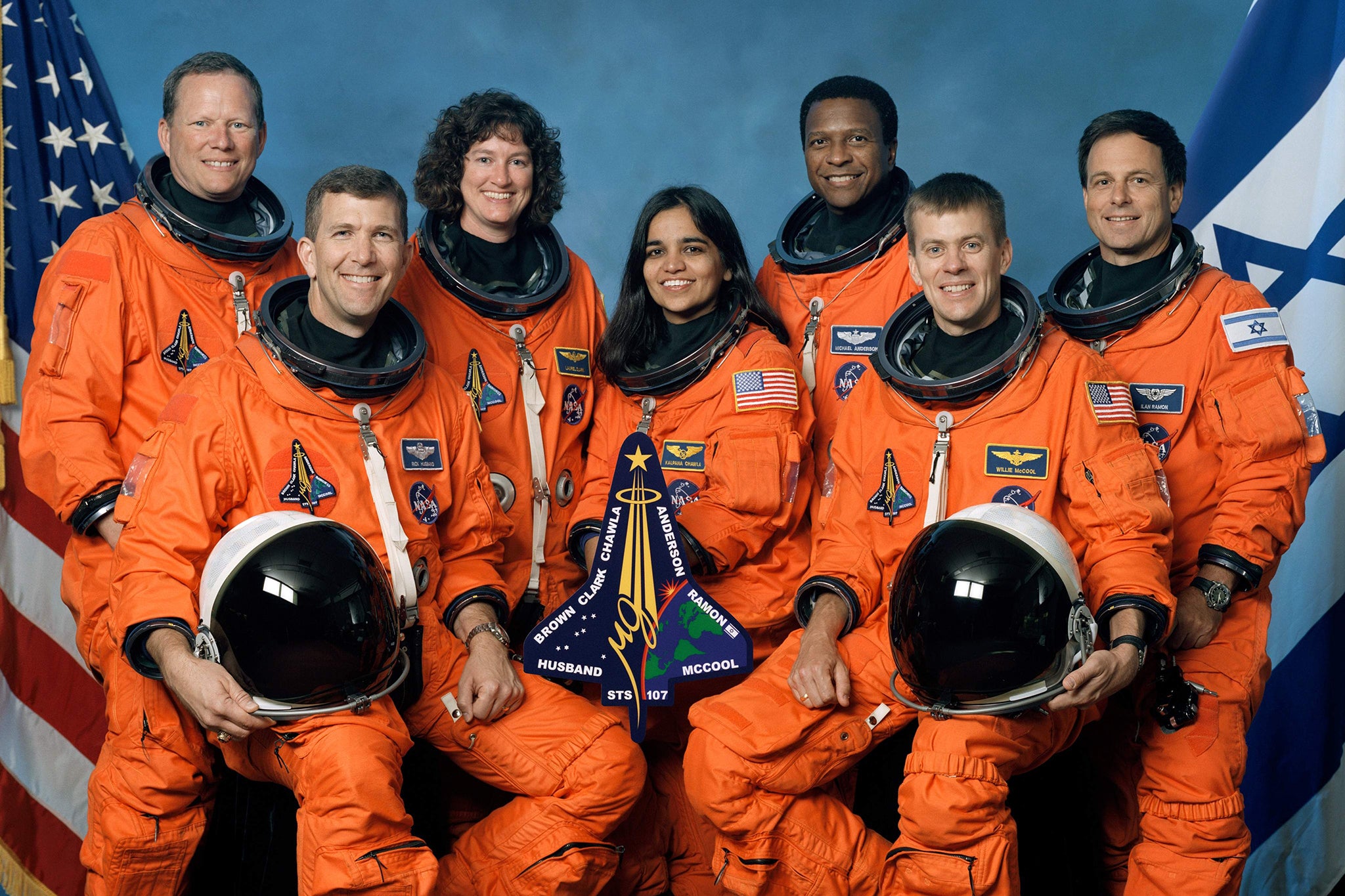The crew of Space Shuttle Columbia's mission, who died on 1 February, 2003 when their spacecraft broke up on reentry. Front row, left to right: Mission commander Rick D. Husband (L), mission specialist Kalpana Chawla, and pilot William C. McCool. Standing, left to right: mission specialists David M. Brown, Laurel B. Clark, and Michael P. Anderson; payload specialist Ilan Ramon